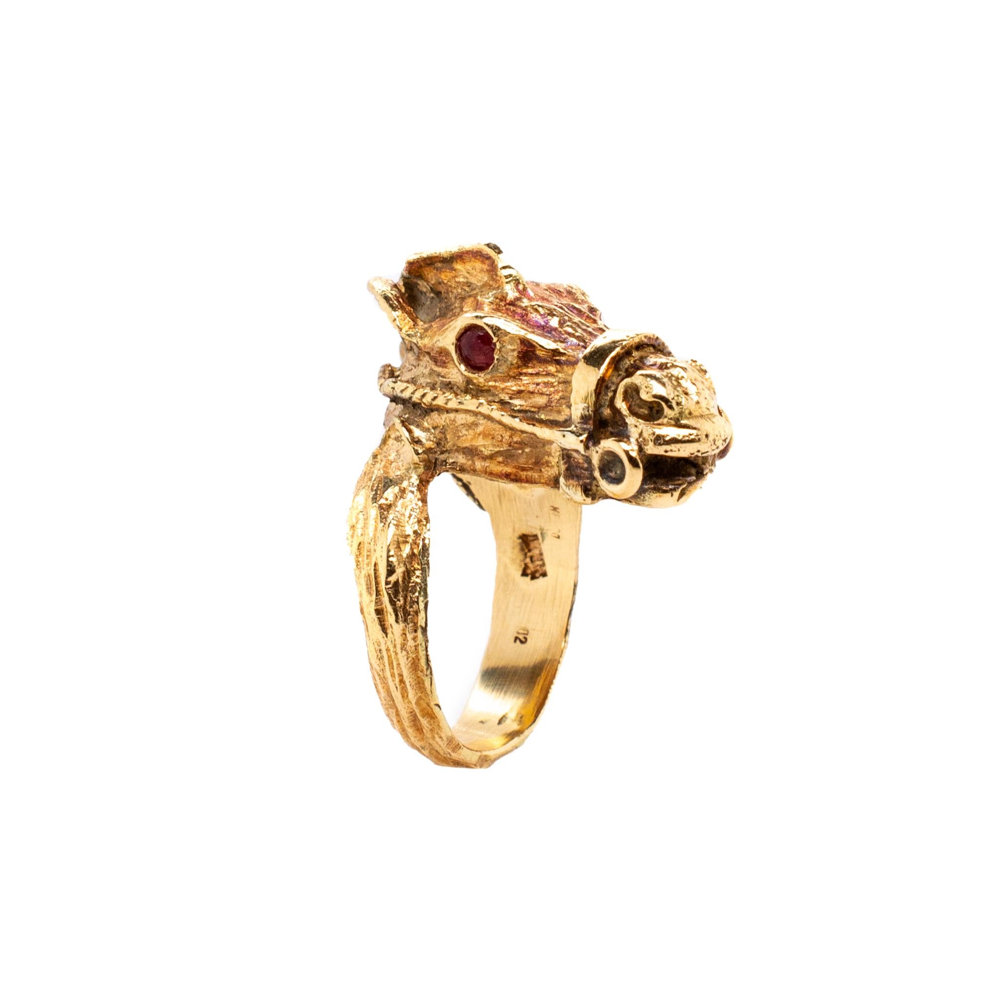 One hand made textured & polished 14K yellow gold, ruby vintage ring with a slightly rounded shank. The ring is a size 6.75. The ring weighs a total of 11.80 grams. Engraved with 