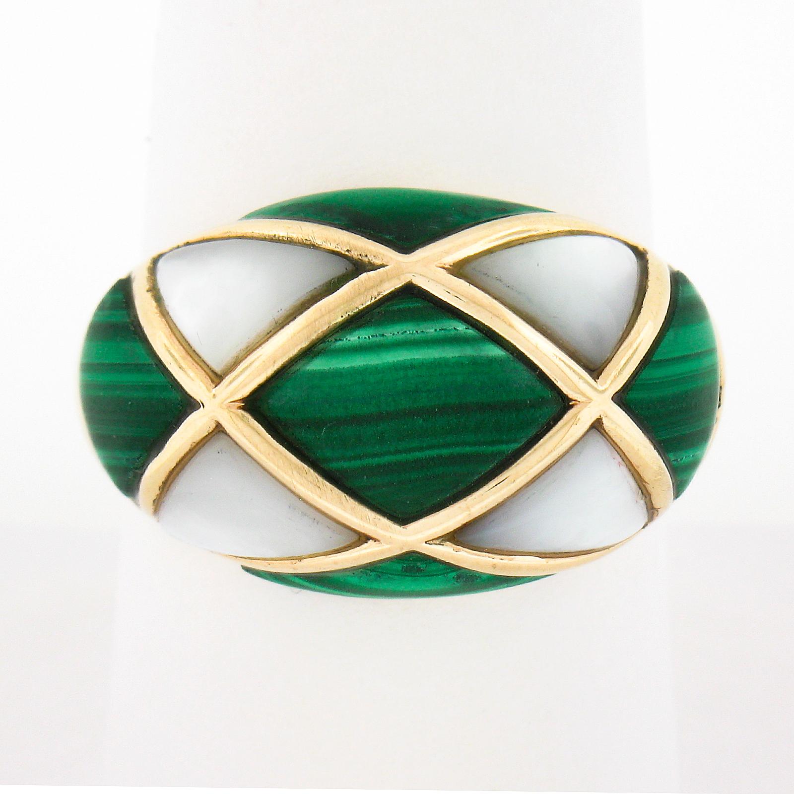 Here we have an absolutely magnificent cocktail ring that was crafted from solid 14k yellow gold. It features a domed top that is set with the most gorgeous natural malachite and mother of pearl stones in which have been custom cut and perfectly set