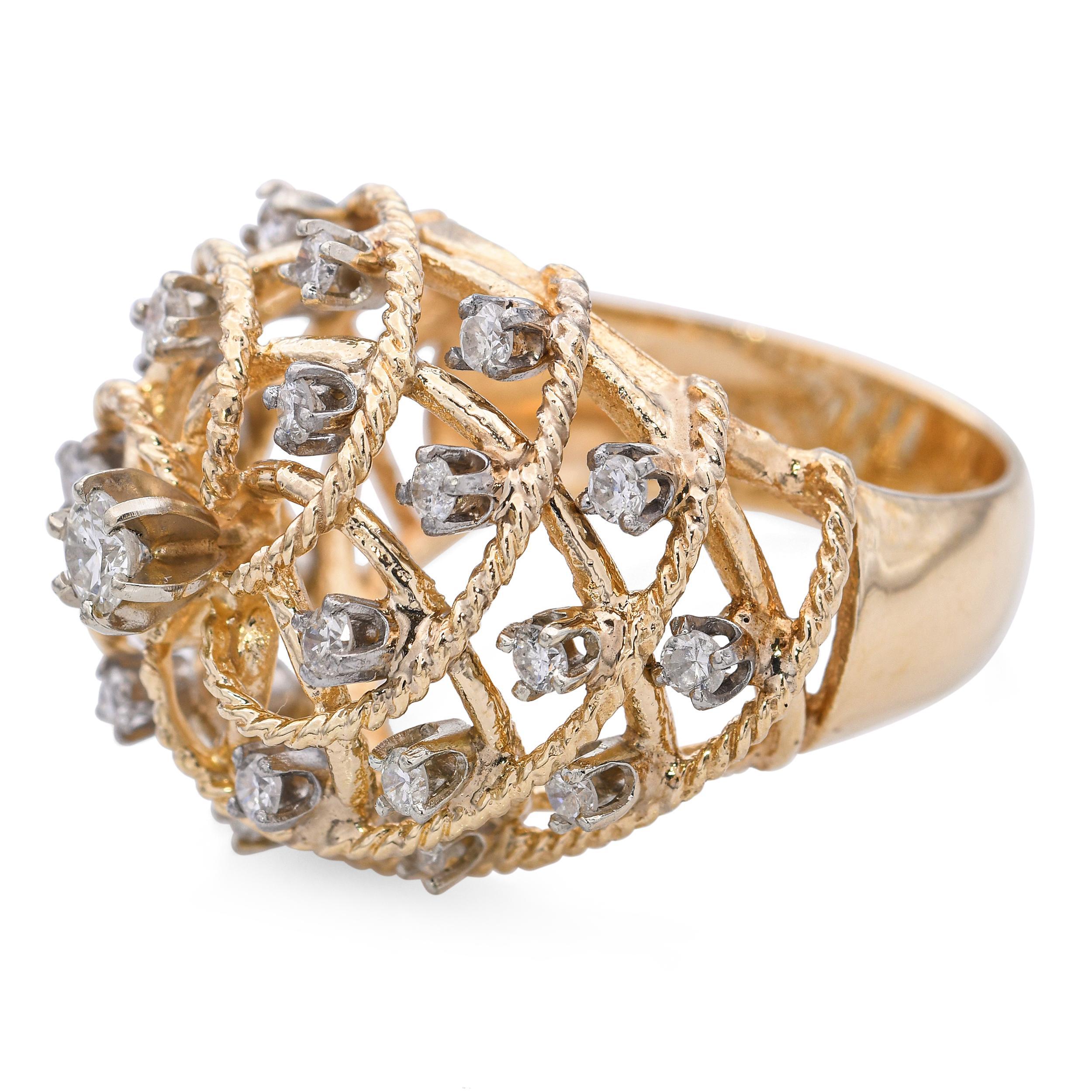 This vintage 14k yellow gold statement ring features a bold, intertwined basket-style design that exudes texture and dimension. The openwork gold strands are skillfully woven together, creating a dynamic and sculptural silhouette. With its