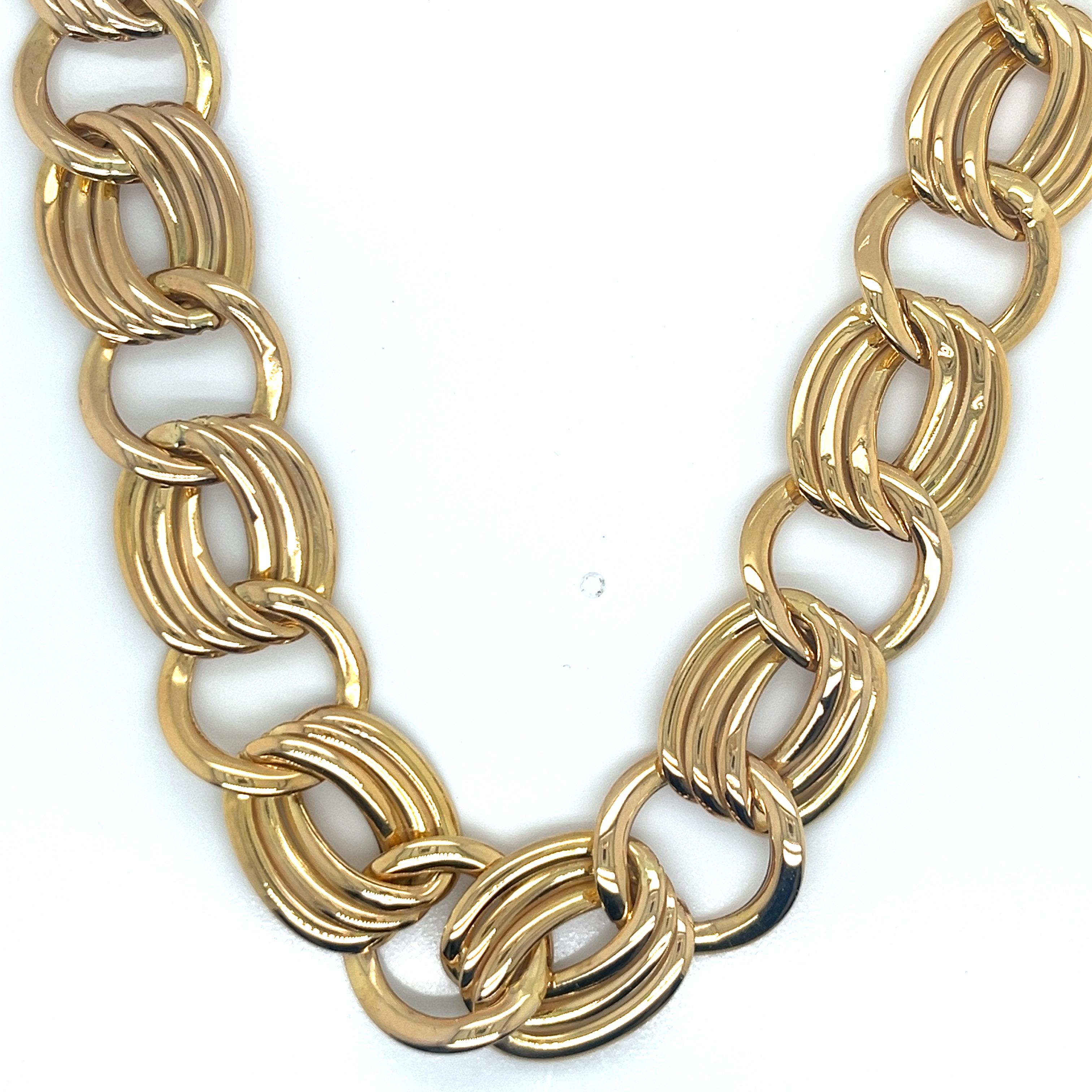 This striking necklace is a true testament to Italian craftsmanship from the 1990s. Expertly crafted in luxurious 14k yellow gold, it showcases a bold and eye-catching open link cable design. The substantial weight of 39.10 grams gives it a