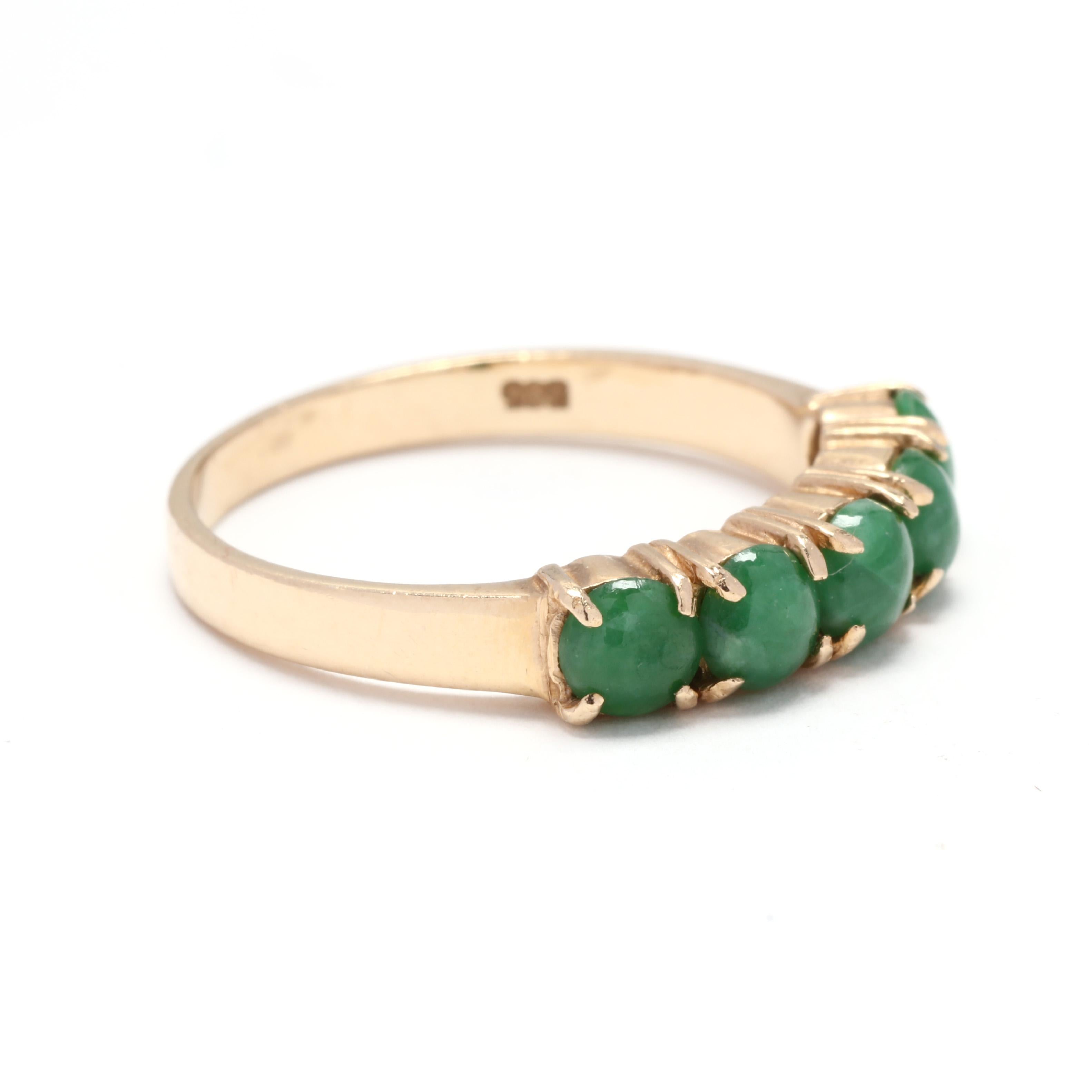 Vintage 14 karat yellow gold jade five stone stackable band ring. This ring features a five stone design with prong set, round cabochon cut jade stones and a slightly tapered band.

Stones:
- jade, 5 stones
- round  cabochon
- 4.1 - 4.25 mm

Ring
