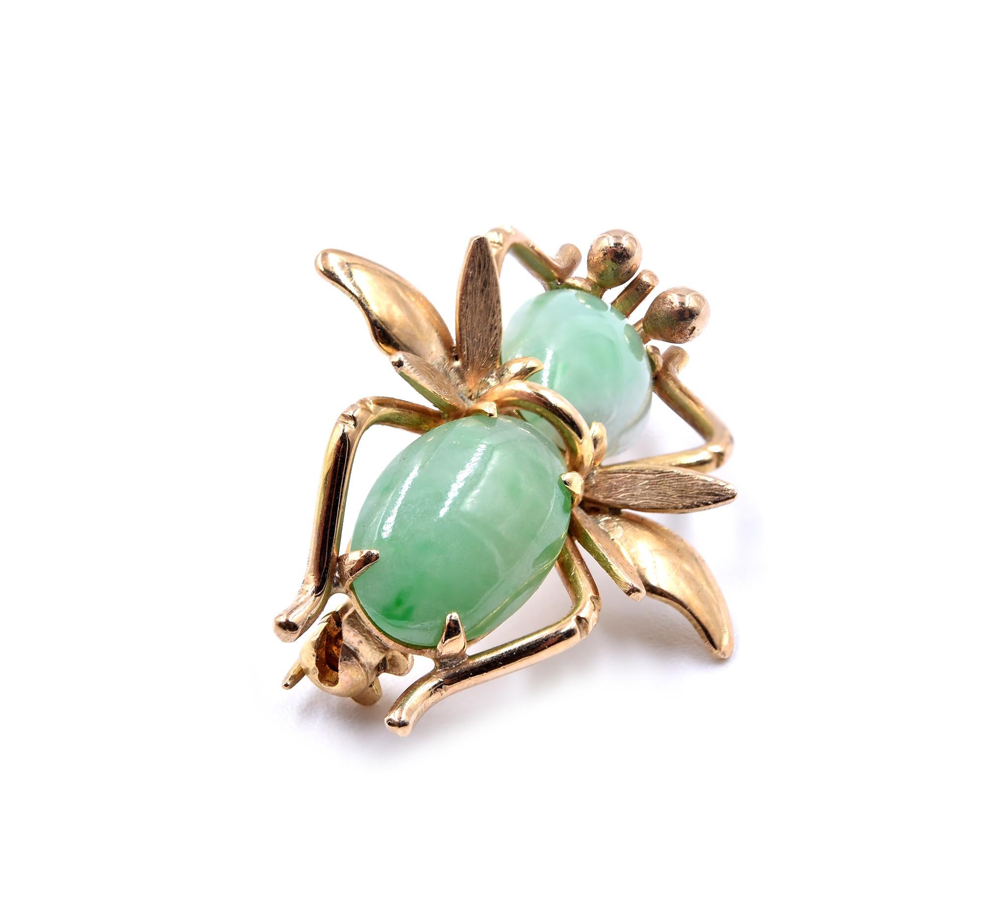 Designer: custom design 
Material: 14k yellow gold
Gemstone: Jade
Dimensions: pin is approximately 20.44mm by 24.35mm
Weight: 3.28 grams

