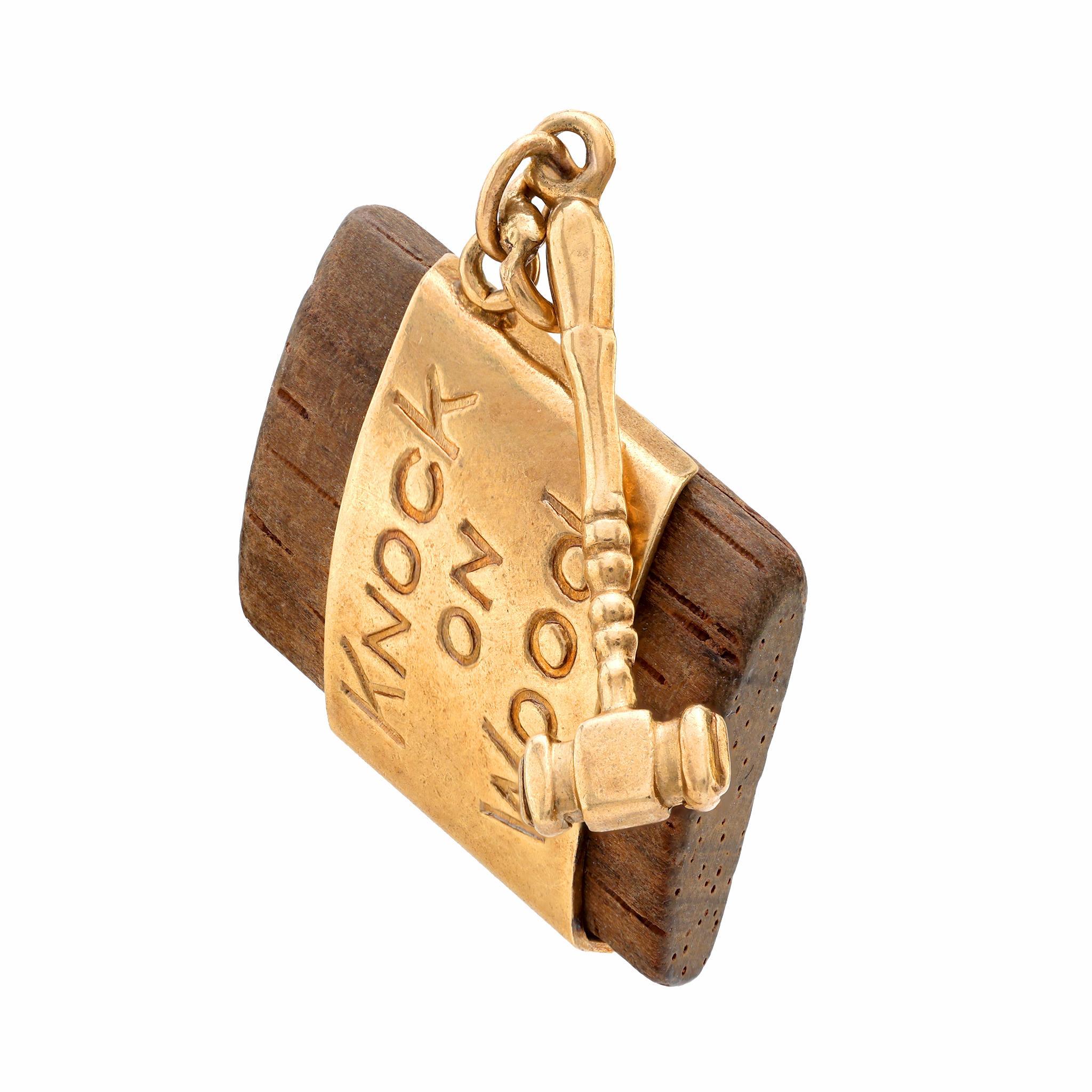 This vintage 14k yellow gold charm uniquely combines natural wood with sleek gold accents, creating a bold and distinctive design from the 1960s.

Center Stone: Wood
Metal: 14K yellow gold 
Era: Vintage
Circa: 1960's
Hallmarks: Purity mark
Size: 1/2