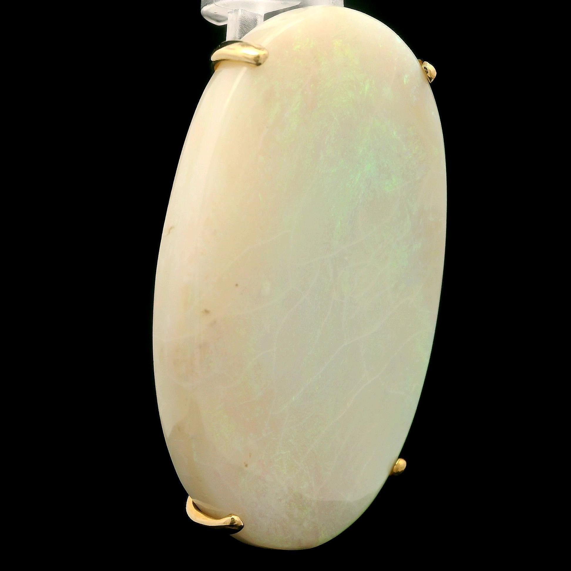 --Stone(s):--
(1) Natural Genuine Opal - Oval Cabochon Cut - Prong Set - White Base w/ Light Play of Colors-  45.4x29.6mm (approx.)

Material: Solid 14K Yellow Gold w/ White Gold Pin
Weight: 16.01 Grams
Brooch Backing: Pin w/ Rotating Closure &