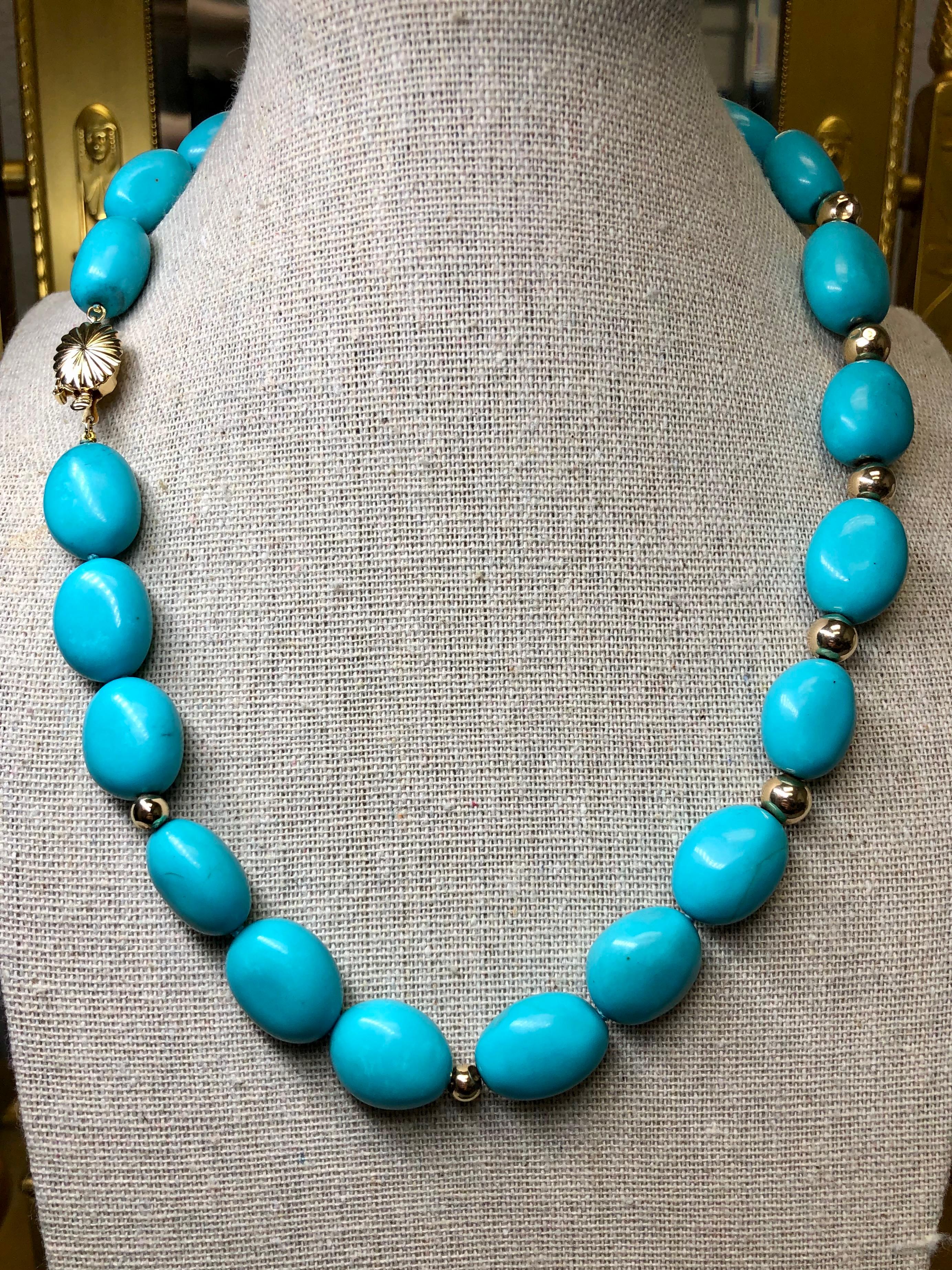 
A gorgeous turquoise necklace strung with 22 polished turquoise stones separated by 14K rondells with a 14K clasp. Beautiful color.


Dimensions/Weight:

Necklace measures 18” and weighs 87.4g.


Condition:

All stones are strung securely and