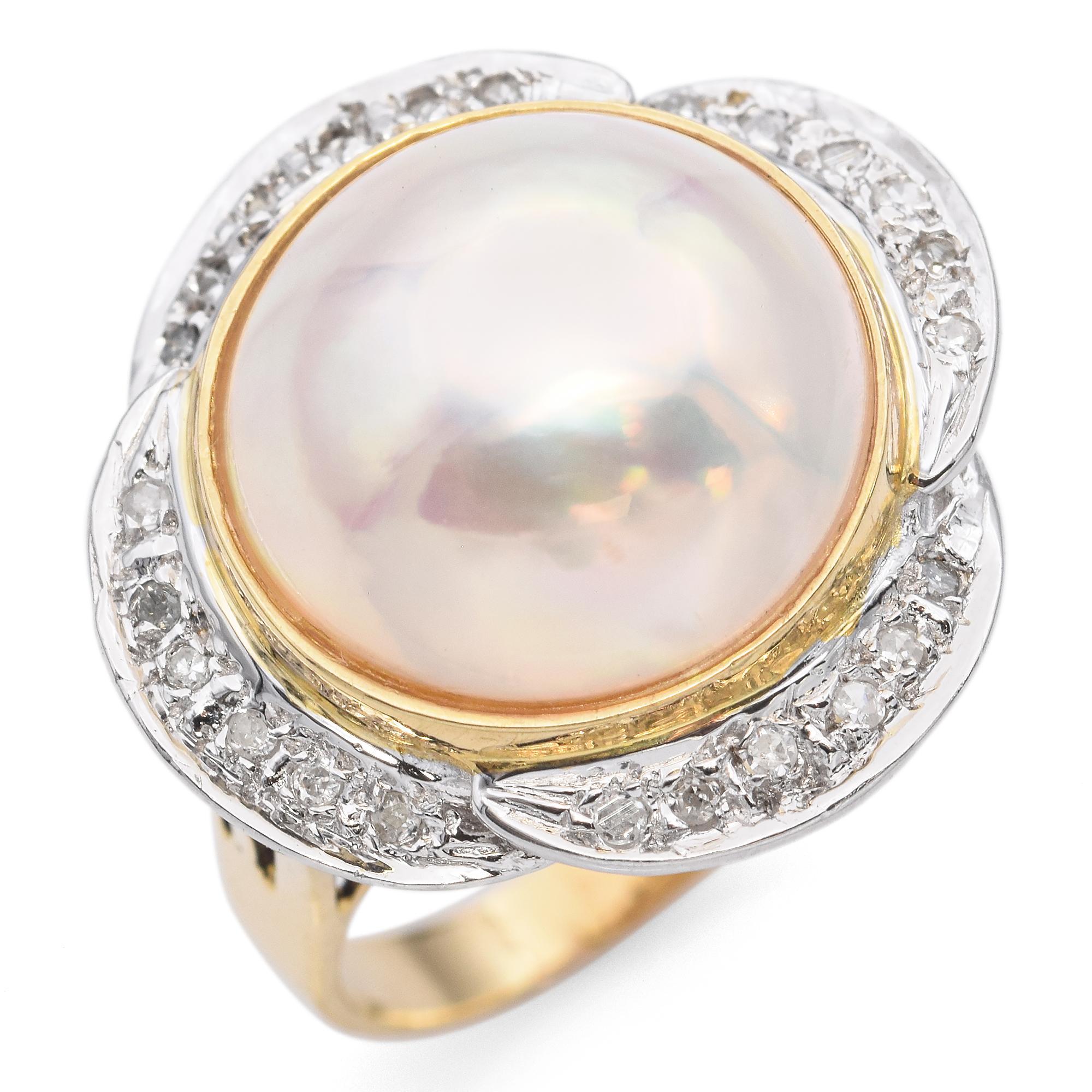 A classic cocktail ring featuring a lustrous Mabe pearl as the centerpiece.
The ring is accented by sparkly diamonds set around the pearl, enhancing its elegance.
Crafted in 14k yellow gold, this exquisite piece is a testament to fine
