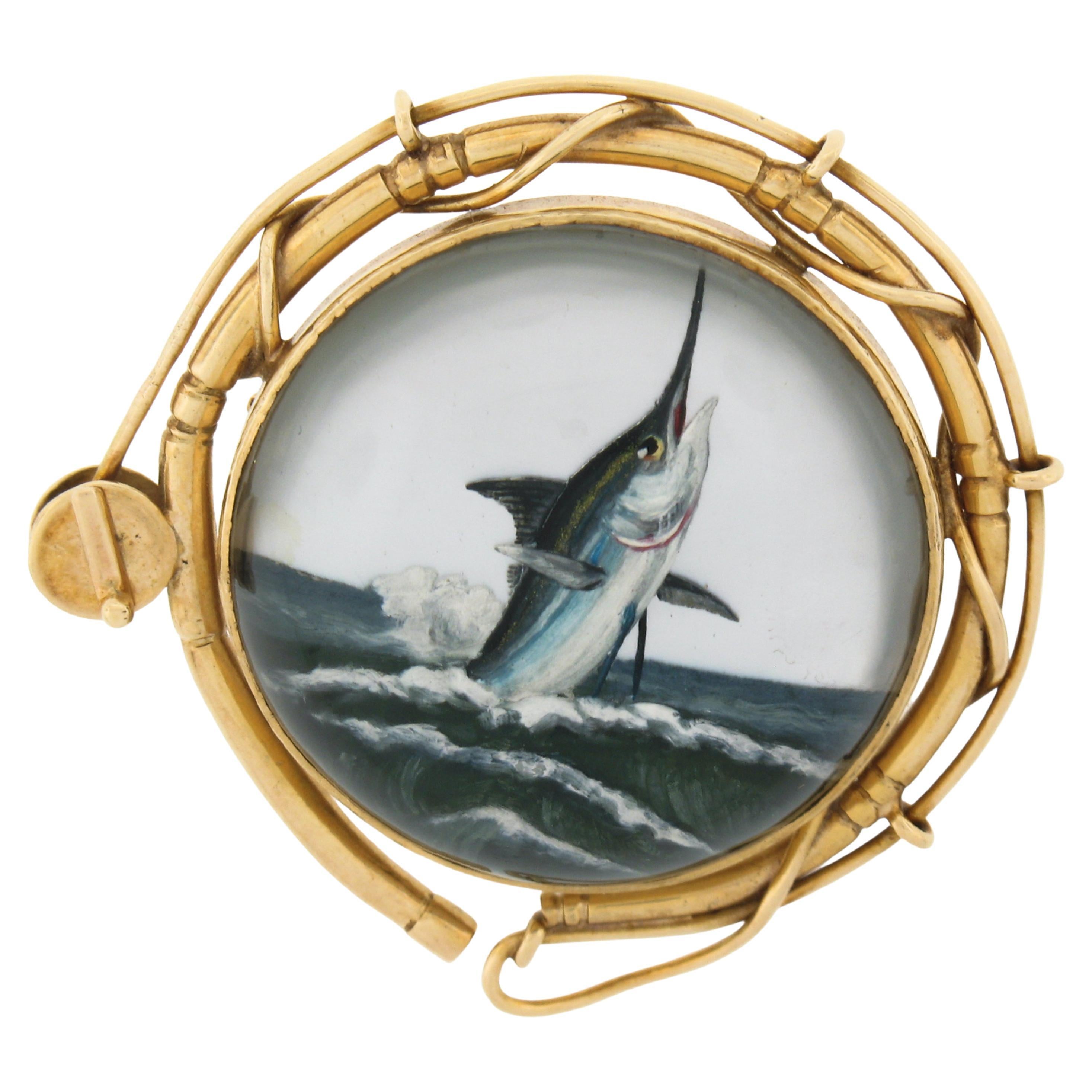 Vintage 14k Yellow Gold Marlin Fish Reverse Intaglio Painted Fishing Reel Brooch For Sale