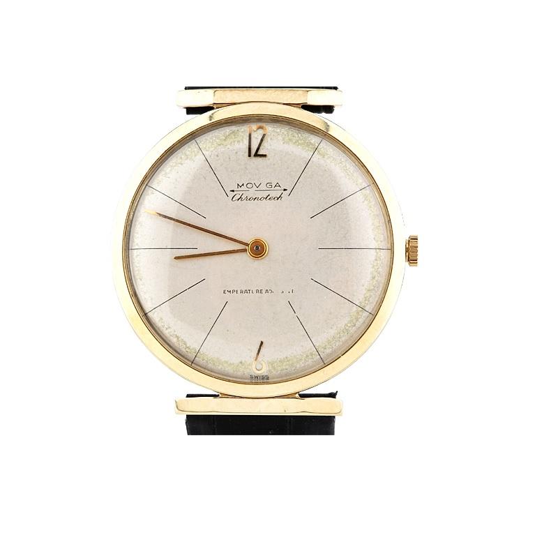 Vintage 14k Yellow Gold Men's Moviga Hand-Winding Watch w/ Leather Strap

14k Yellow Gold and Stainless Steel Case
33 mm in Diameter (35 mm w/ Crown)
Lug-to-Lug Distance = 36.5 mm
Thickness = 7 mm

Champagne Dial w/ Black Tick Marks & Gold Hands (M