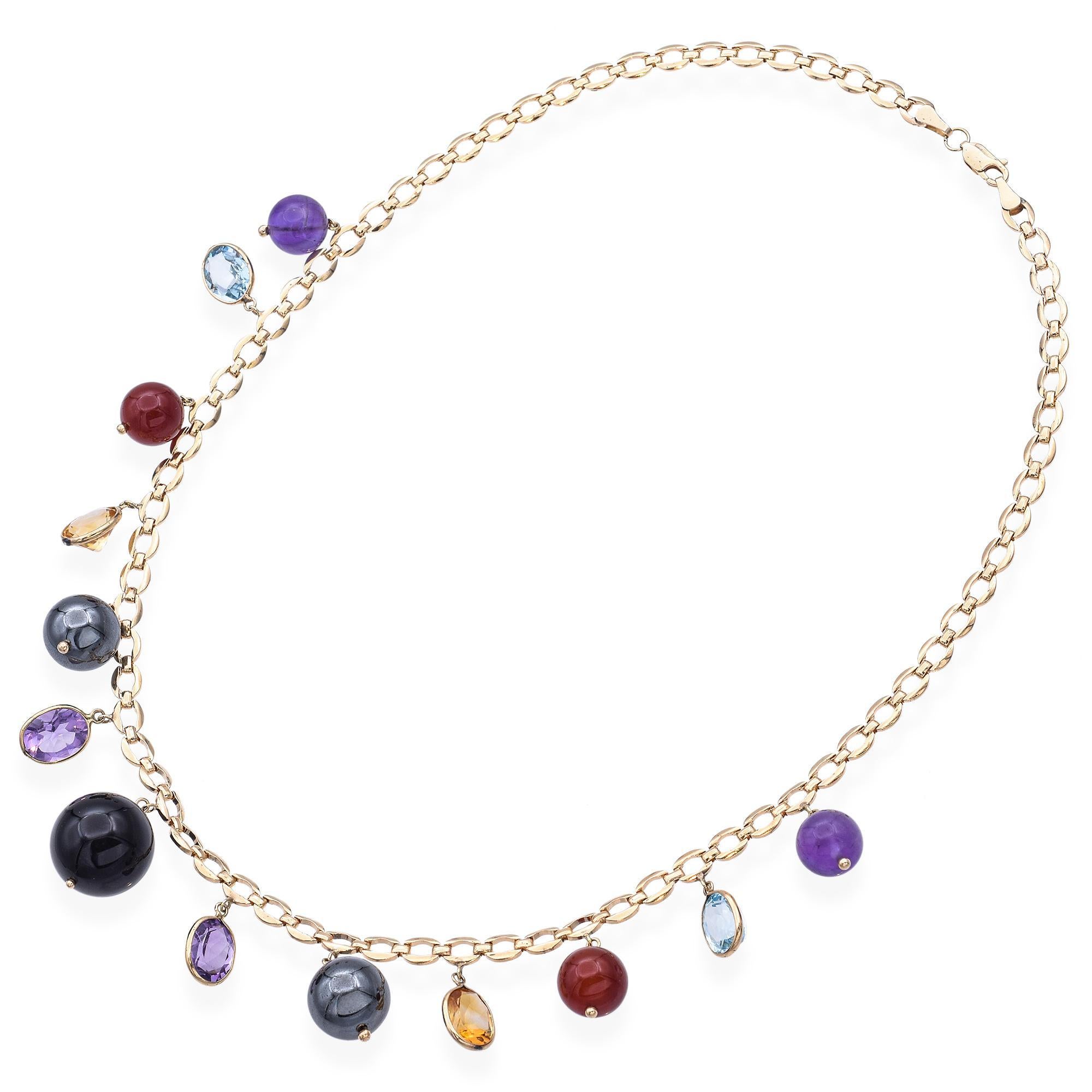 Un collar con un surtido de piedras preciosas, cada una suspendida a lo largo de una cadena de cable de oro amarillo de 14k.

Peso: 40,8 gramos 
Stone: 
Amatista (10 mm, 10 x 7,75 mm)
Topacio (9,5 x 7,25 mm)
Cornalina (10,5 mm)
Citrino (9,5 x 7,2