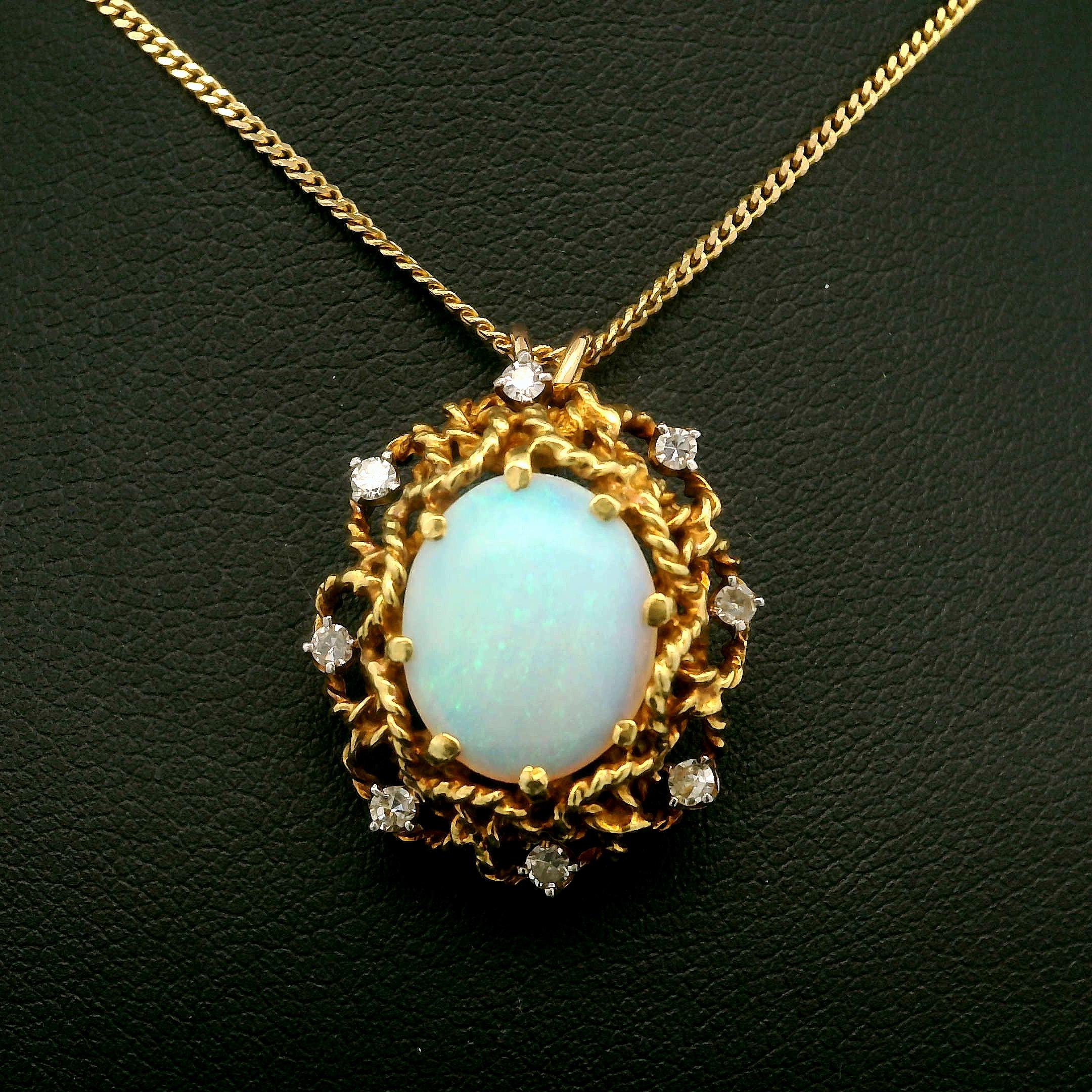–Stone(s)–
(1) Natural Genuine Opal - Oval Cabochon - Prong Set - White Base w/ Nice Play of Color - 11.83 x 9.35mm (approx.)
(8) Natural Genuine Diamond - Old Single Cut - Prong Set - H-J Color - SI1-I2 Clarity - 0.12ctw (approx.)

Material: 14k
