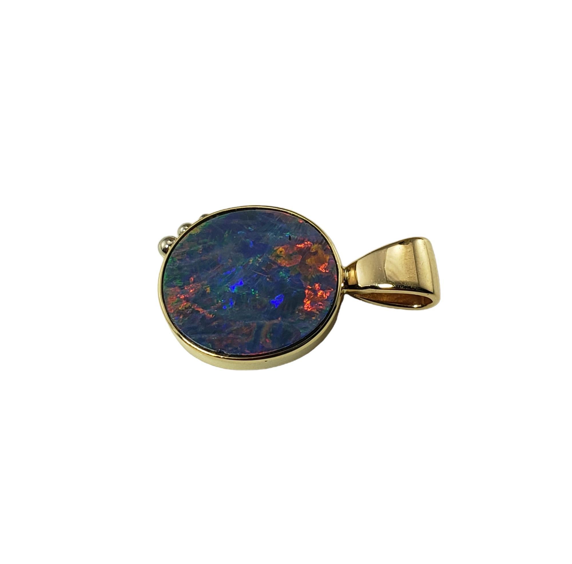 Vintage 14 Karat Yellow Gold and Opal Doublet Pendant JAGi Certified-

This elegant pendant features one oval black opal doublet (16.3 mm x 14.4 mm) set in classic 14K yellow gold.

Size: 26.4 mm x 16.5 mm

Stamped: 14KT

Weight: 4.1 gr./ 2.6