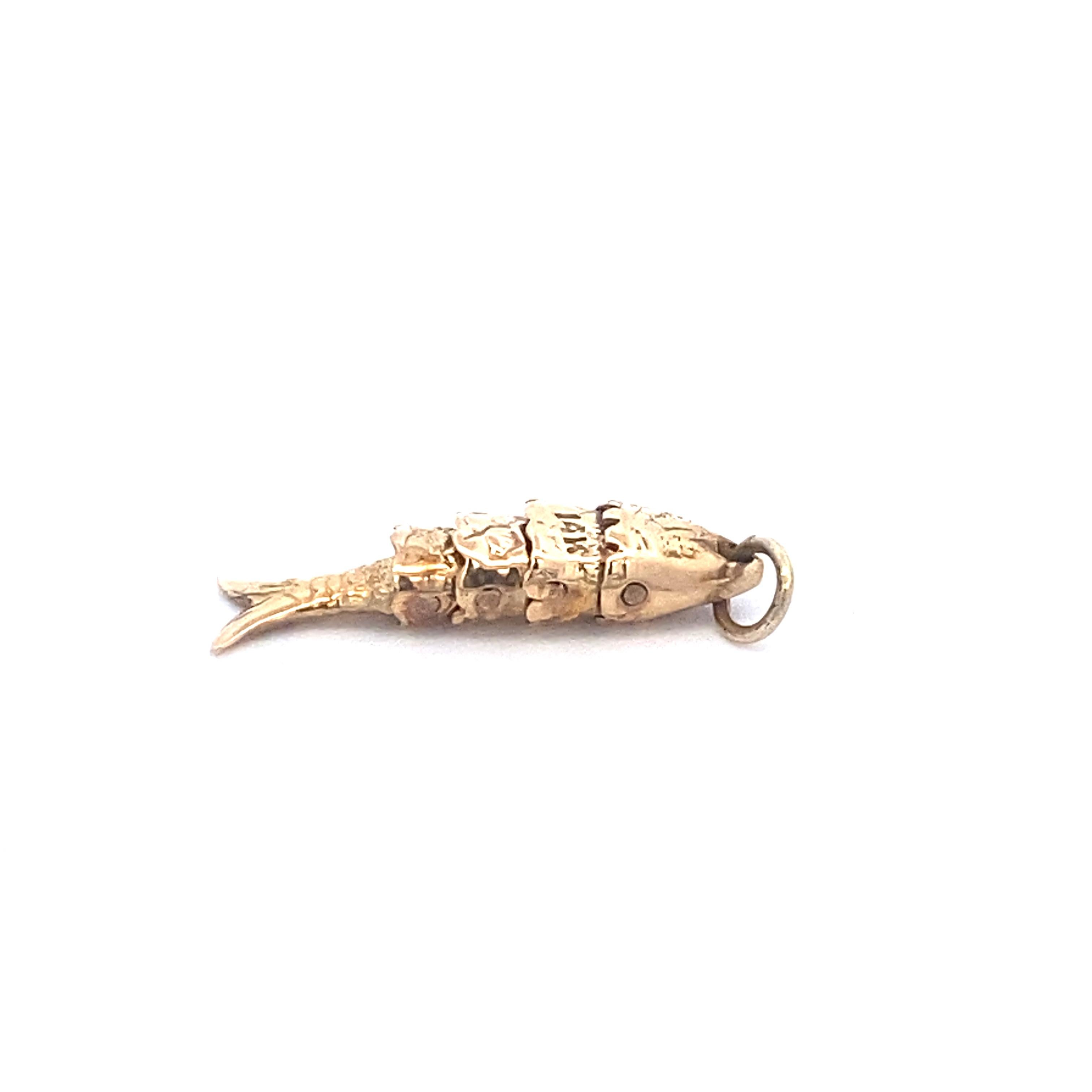 This vintage 14k yellow gold Oscillating Fish Charm Pendant is the perfect addition to your favorite charm bracelet or dainty gold necklace. This unique fish charm is marked and tested 14k. Whether you love fishing or just need a quirky and fun new