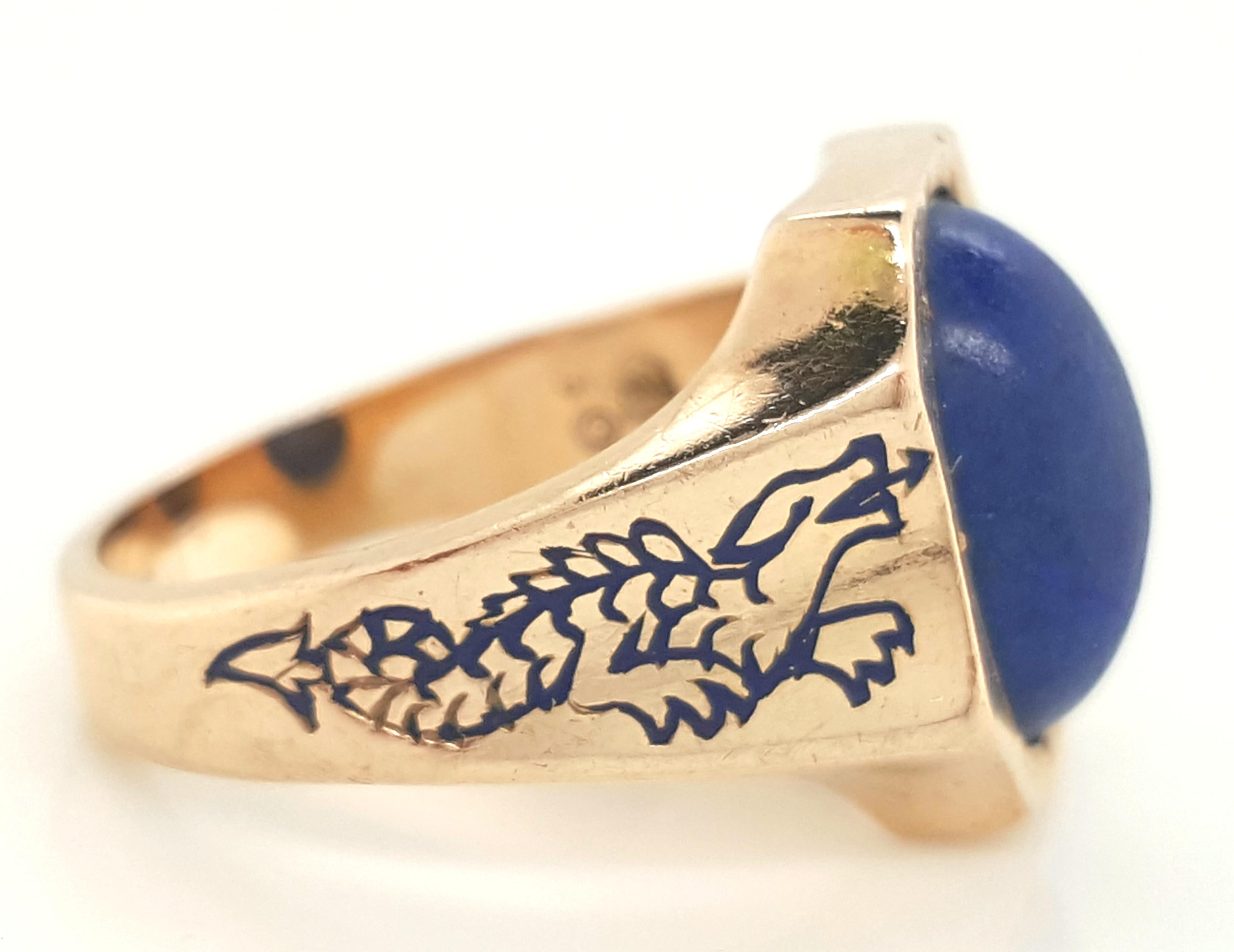 Vintage 14K Yellow Gold Lapis Lazuli and Blue Enamel Ring  The ornate bezel encases an oval cabochon lapis lazuli that elegantly curves close to your finger.   Engraved down either side of the shank is a dragon accented with royal blue enamel.   The