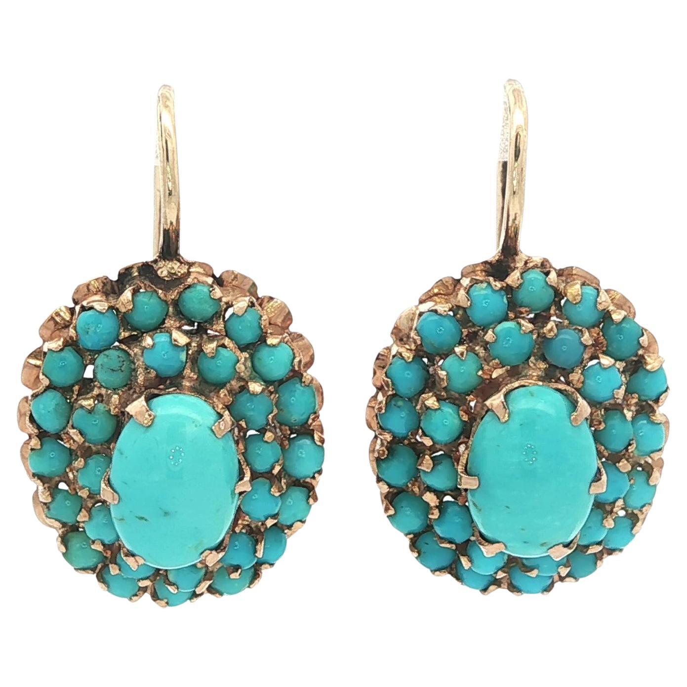 Orecchini pendenti a grappolo in oro giallo 14k con turchesi ovali e rotondi