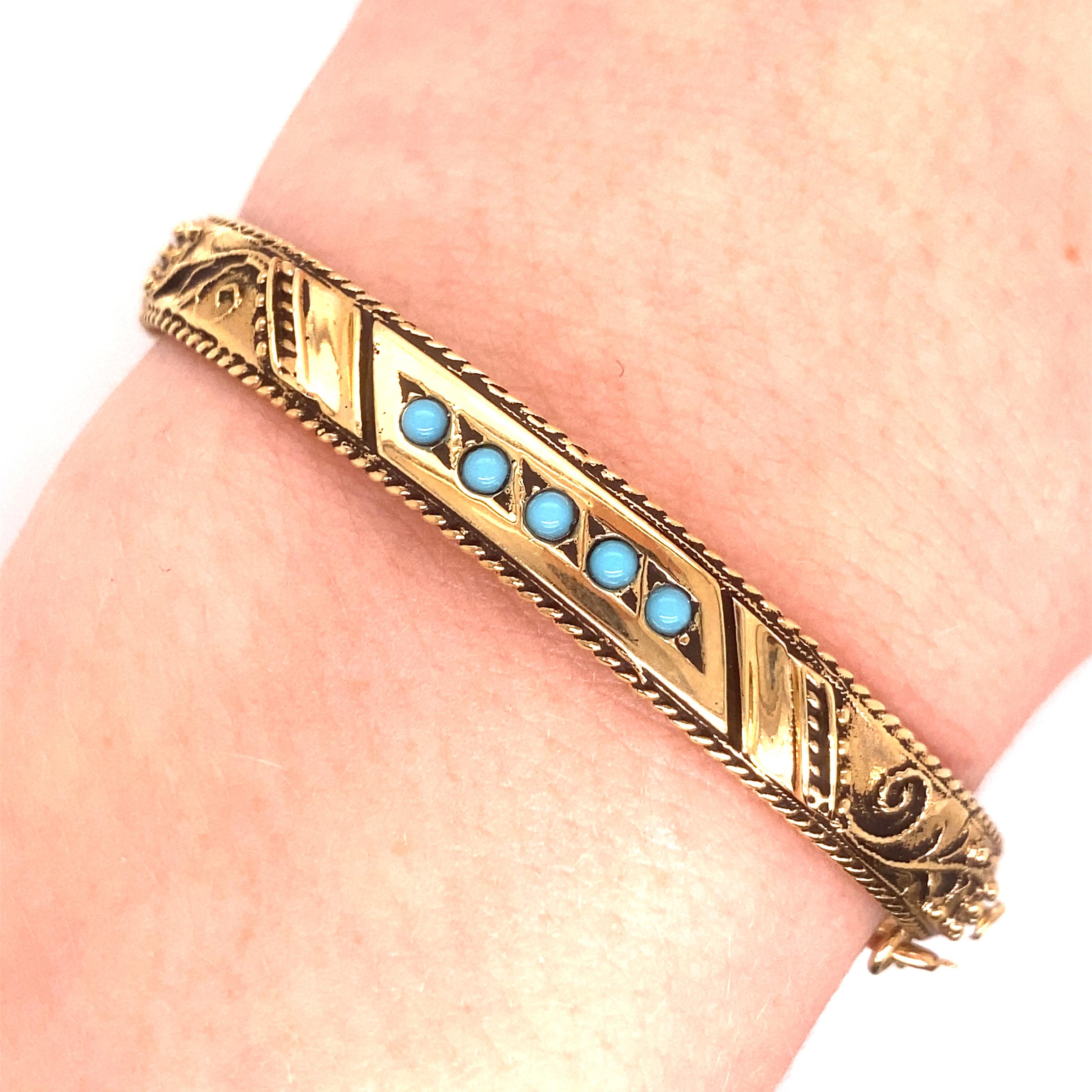 Vintage 14K Yellow Gold Oxidized Turquoise Bangle - The bangle contains 5 round turquoise stones surrounded by oxidized gold design. The bracelet's width is .25 inches. The inside diameter is 1.85 inches high by 2.25 inches wide. The bracelet weighs