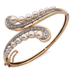 Vintage 14k Yellow Gold Pearl and Diamond Bypass Hinged Bangle Bracelet