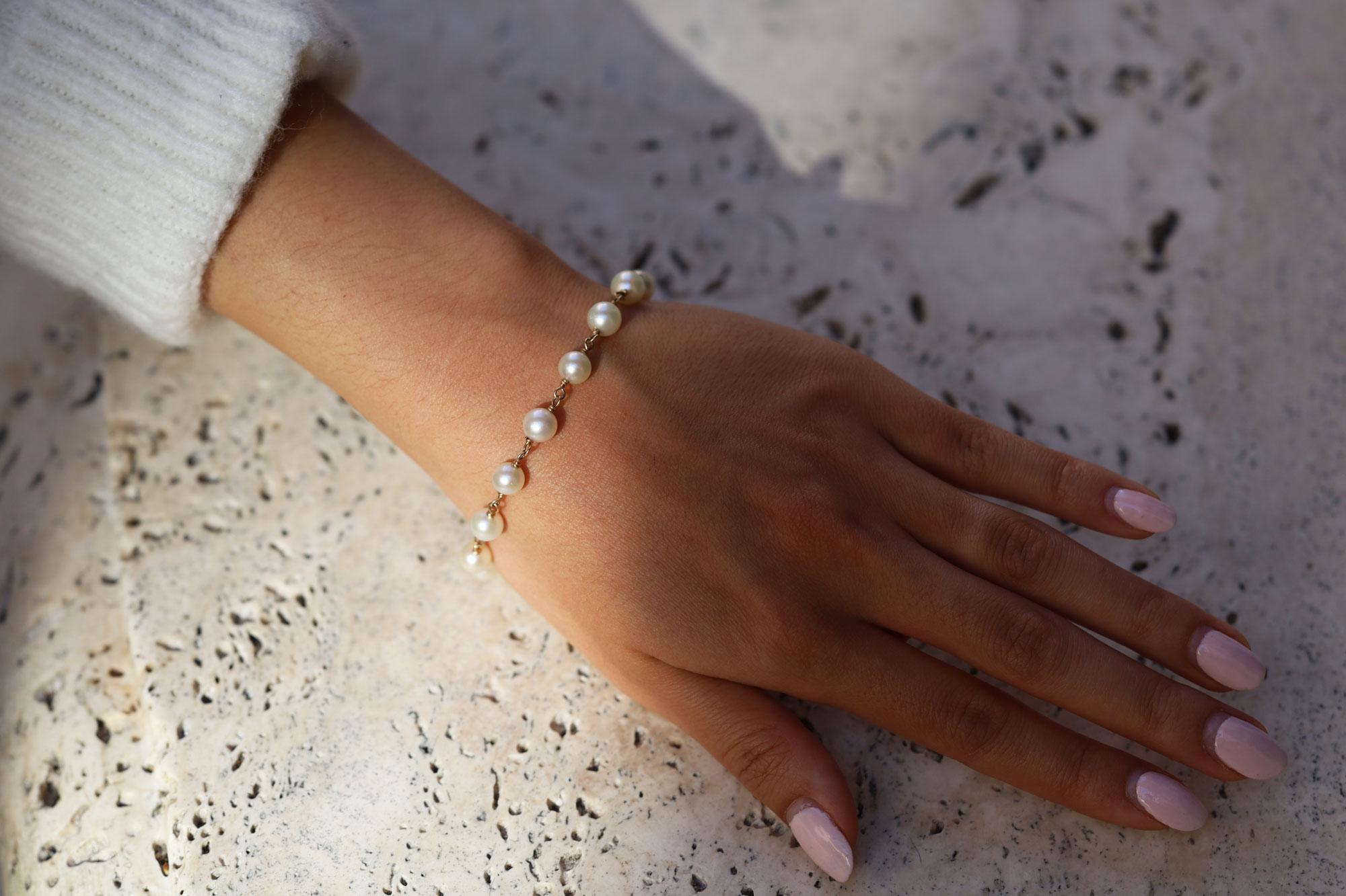 This stunning bracelet features 14 luminescent cultured Akoya salt water pearls linked along a 14k yellow gold chain. Achieve a lavish look at a fraction of the cost of the Elsa Peretti for Tiffany bracelet. Crafted with sustainability in mind, each