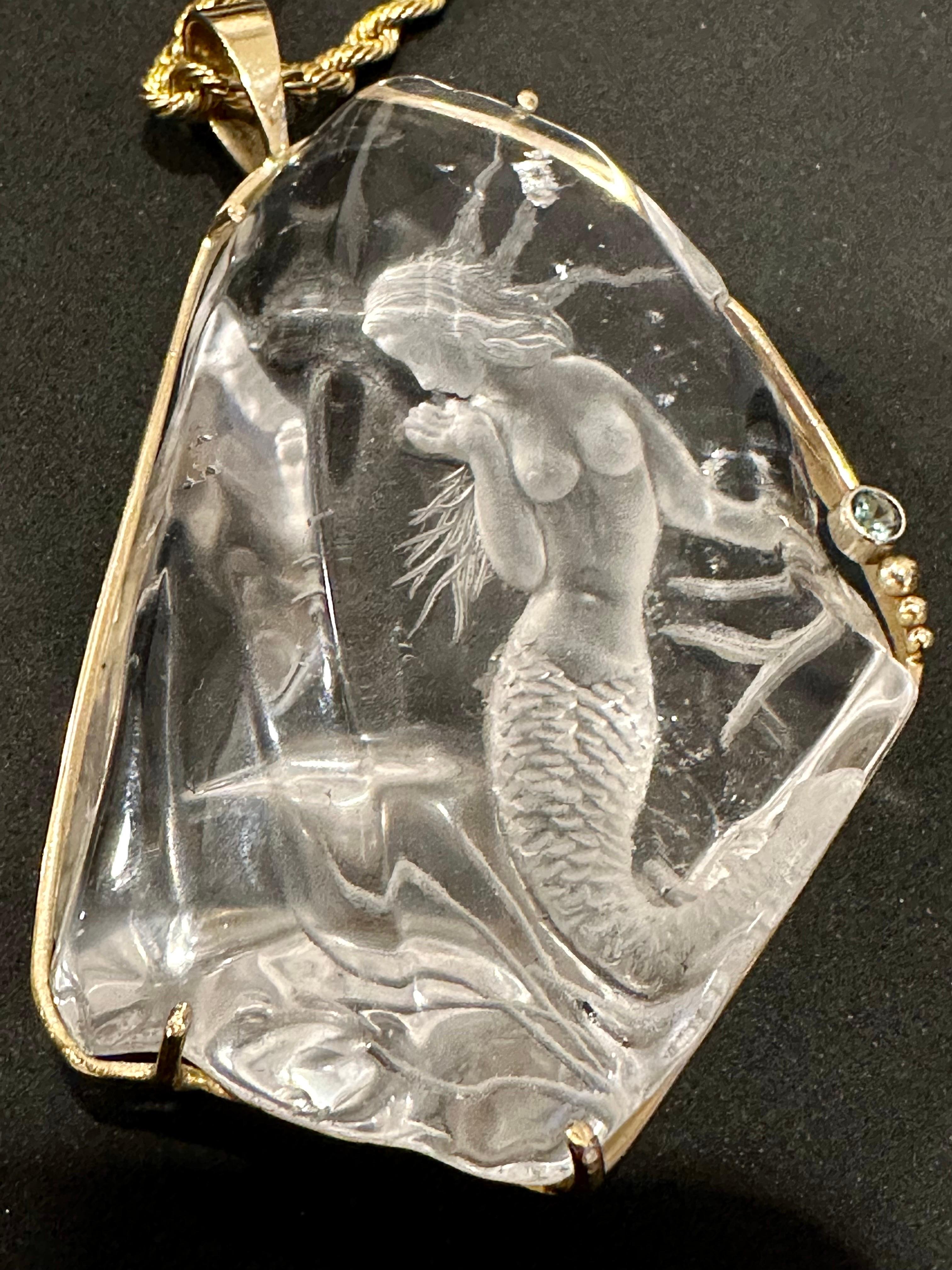 
For your consideration, this fabulous vintage 14K yellow gold fitted Crystal Mermaid figurine pendant is a must-have in your jewelry collection. The craft of the pendant is Amazing, with intricate details and excellent craftsmanship. 

The pendant