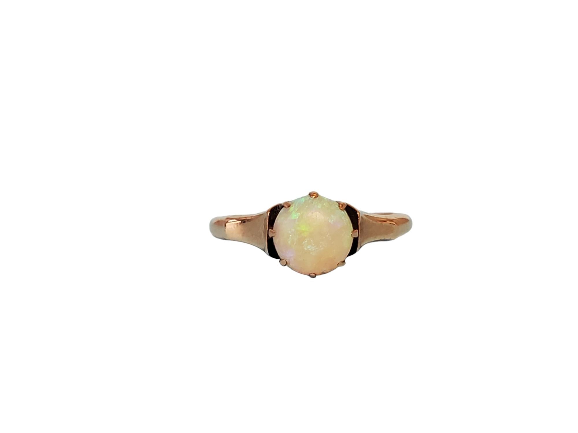 Vintage Round White Opal Crown Solitaire 

Listed is this understated sweet and beautiful opal engagement solitaire. The opal has color plays of neon green and blue hues coming off of it and inviting you in to enjoy the timeless crown solitaire that