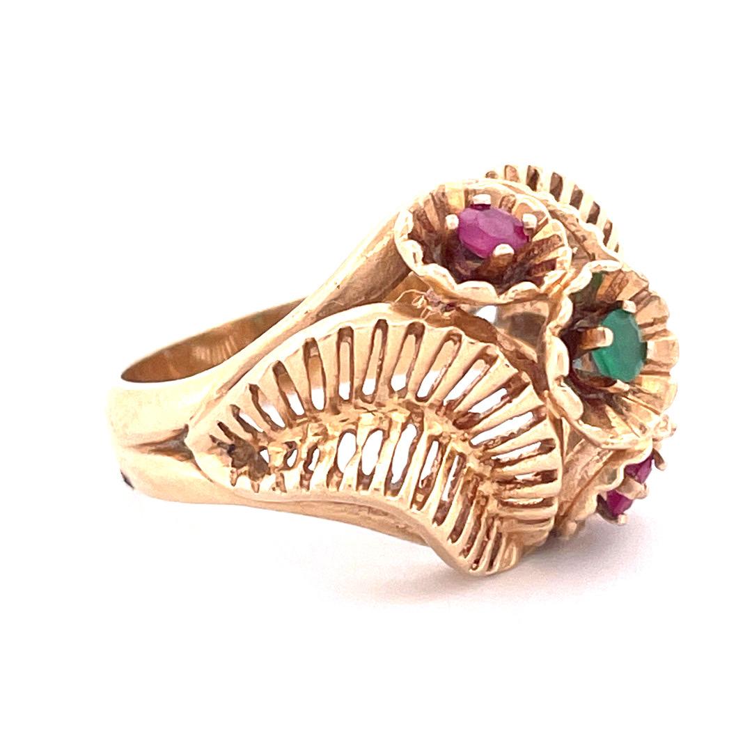 Vintage 14k Yellow Gold Ruby and Emerald Ring

Experience the beauty of vintage jewelry with this stunning 14k yellow gold ring. The intricately carved centerpiece is the star of the show, featuring two round-cut rubies and one round-cut emerald.