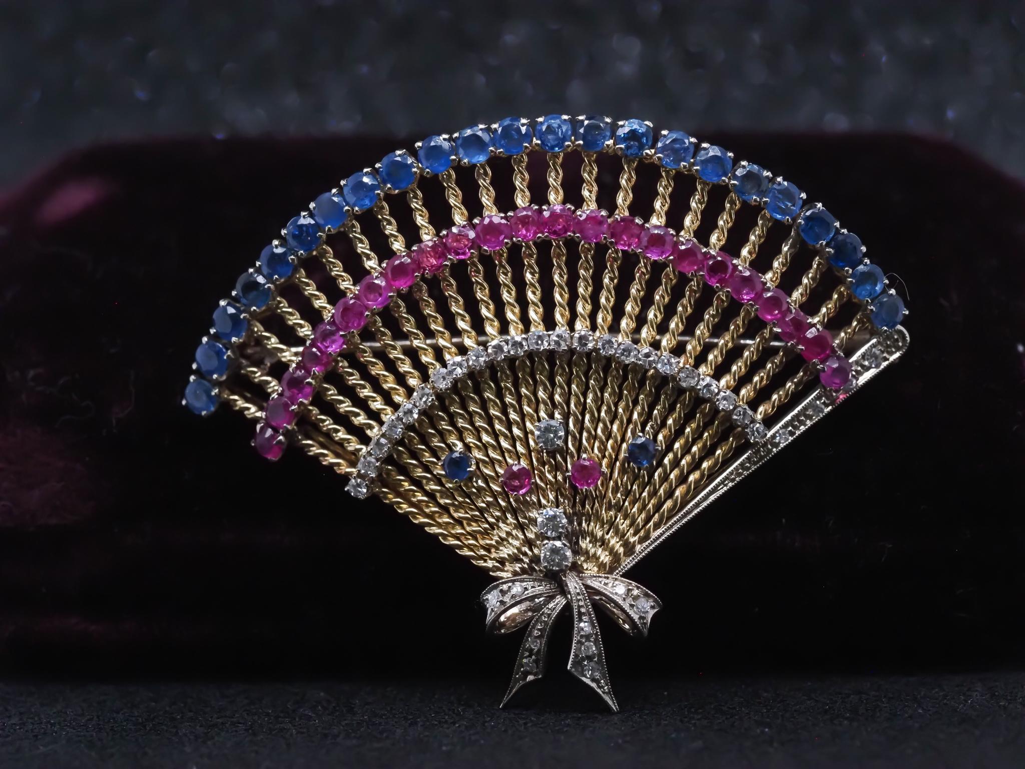 Item Details:
Metal Type: 14K Yellow Gold [Hallmarked, and Tested]
Weight: 20.1 grams

Stone Details: Natural Rubies, Sapphires, Diamonds.

Pin Measurements:
Diameter: 2.75 inches x 1.5 inch
Condition: Excellent