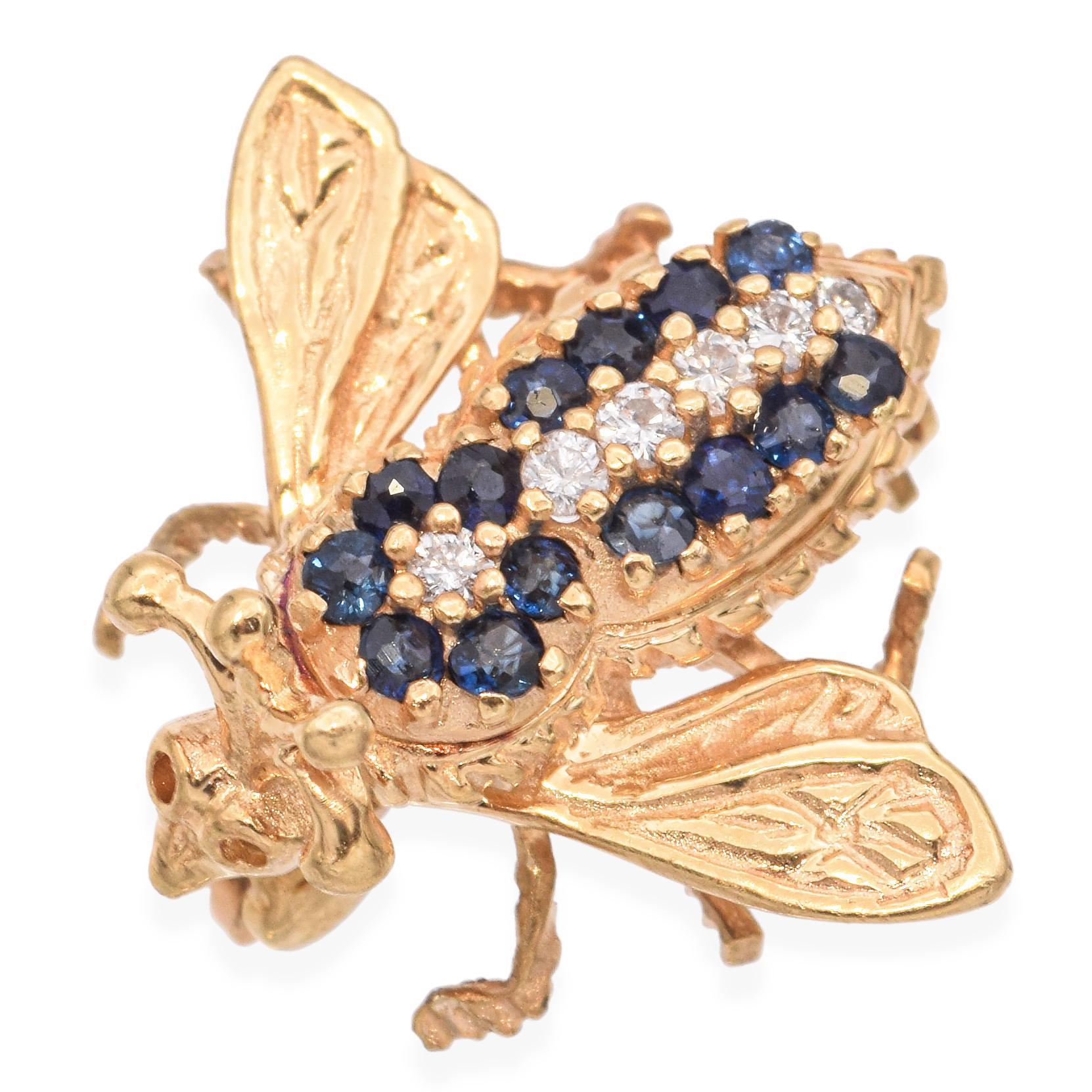 This vintage 14k yellow gold bumblebee brooch is a whimsical and elegant piece, set with deep blue sapphires and sparkling diamonds. The intricate detailing captures the charm of natural forms with a luxurious twist. Its petite size makes it perfect