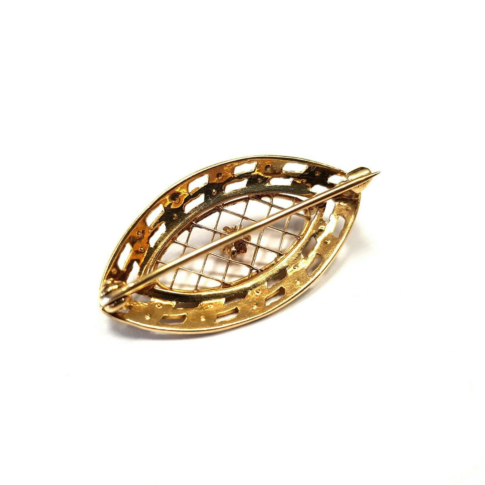  This is a 14k yellow gold shield brooch with very tiny pearls and round diamond 0.08ct. Looks elegant. 
Specifications:
    main stone: TINY PEARLS
    additional: DIAMOND
    diamonds: 1 PCS
    carat total weight: 0.08
    color: G
    clarity: