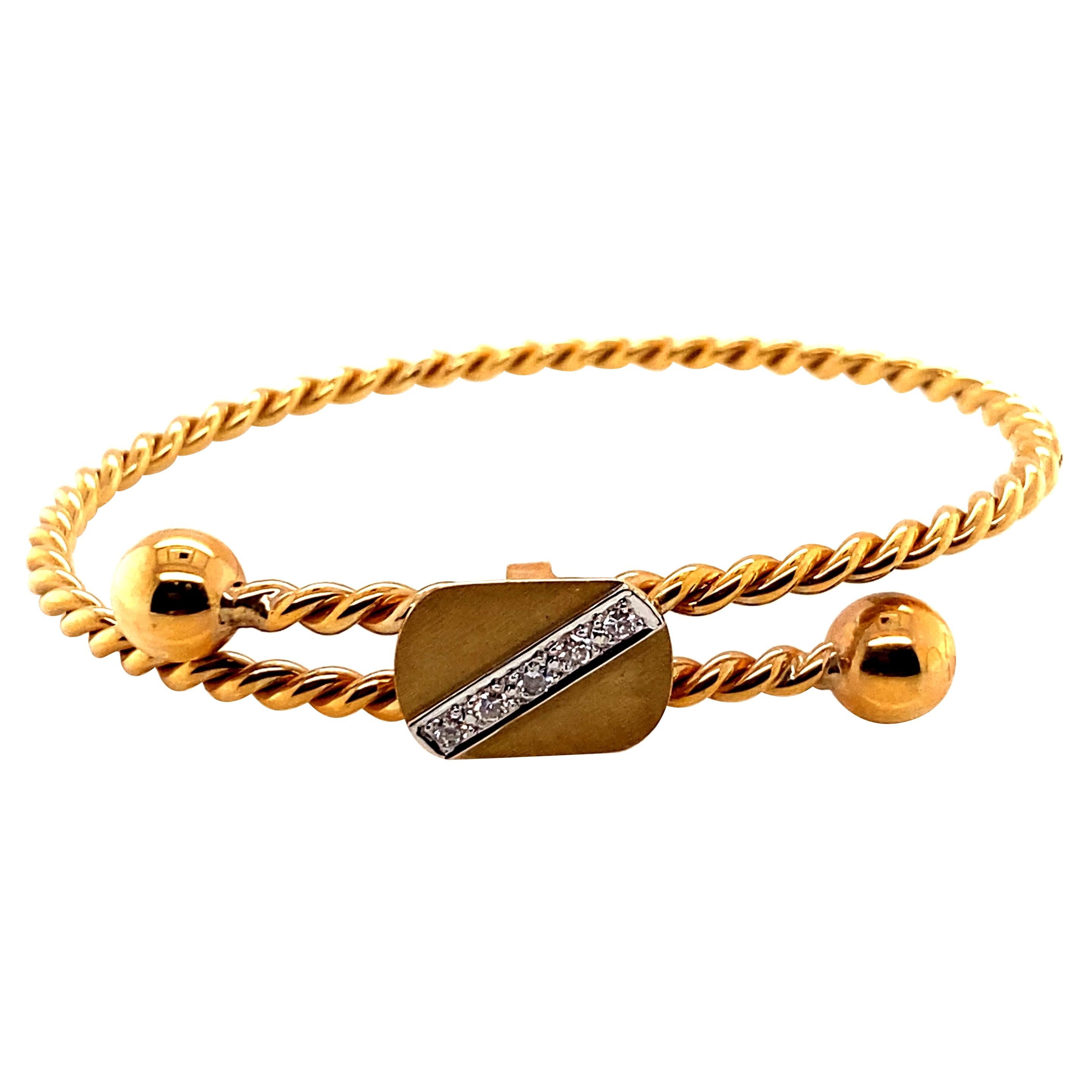 Armreif aus 14 Karat Gelbgold mit Diamanten