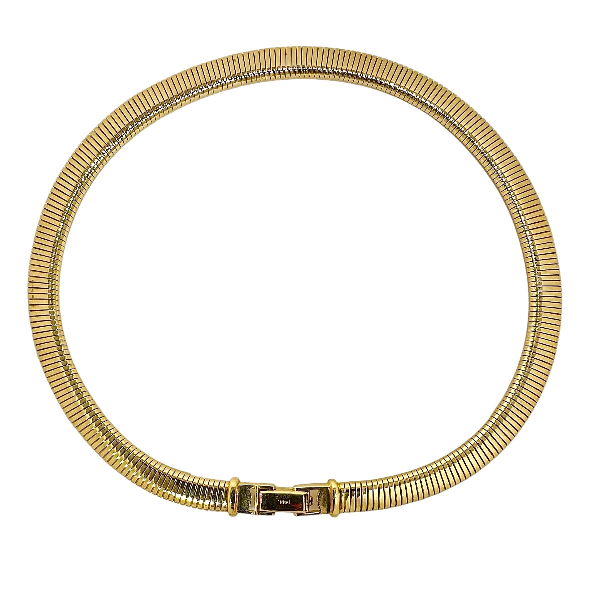 A beautifully made 14K yellow gold tubogas choker that feels smooth to the touch and is extremely comfortable to wear. Unlike many thick tubogas necklaces, this choker appears to be flat, but in fact has rounded edges, and lays beautifully on the
