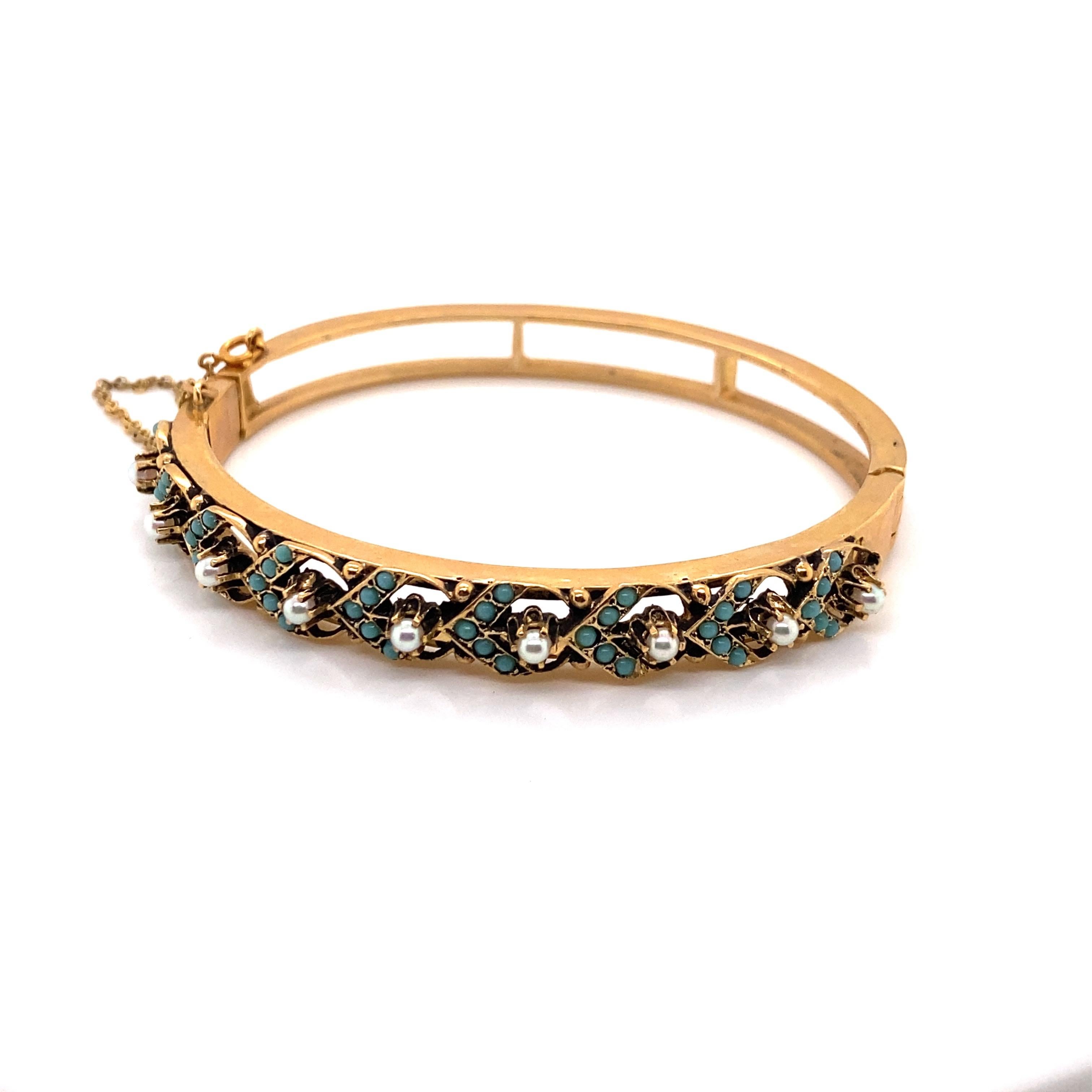 Vintage 14K Yellow Gold Turquoise and Pearl Bangle Bracelet - The bracelet contains 9 seed pearls and a chevron pattern of small turquoise beads. The bracelets is 7mm wide. The inside diameter is 2 inches high and 2.25 inches wide. The bracelets