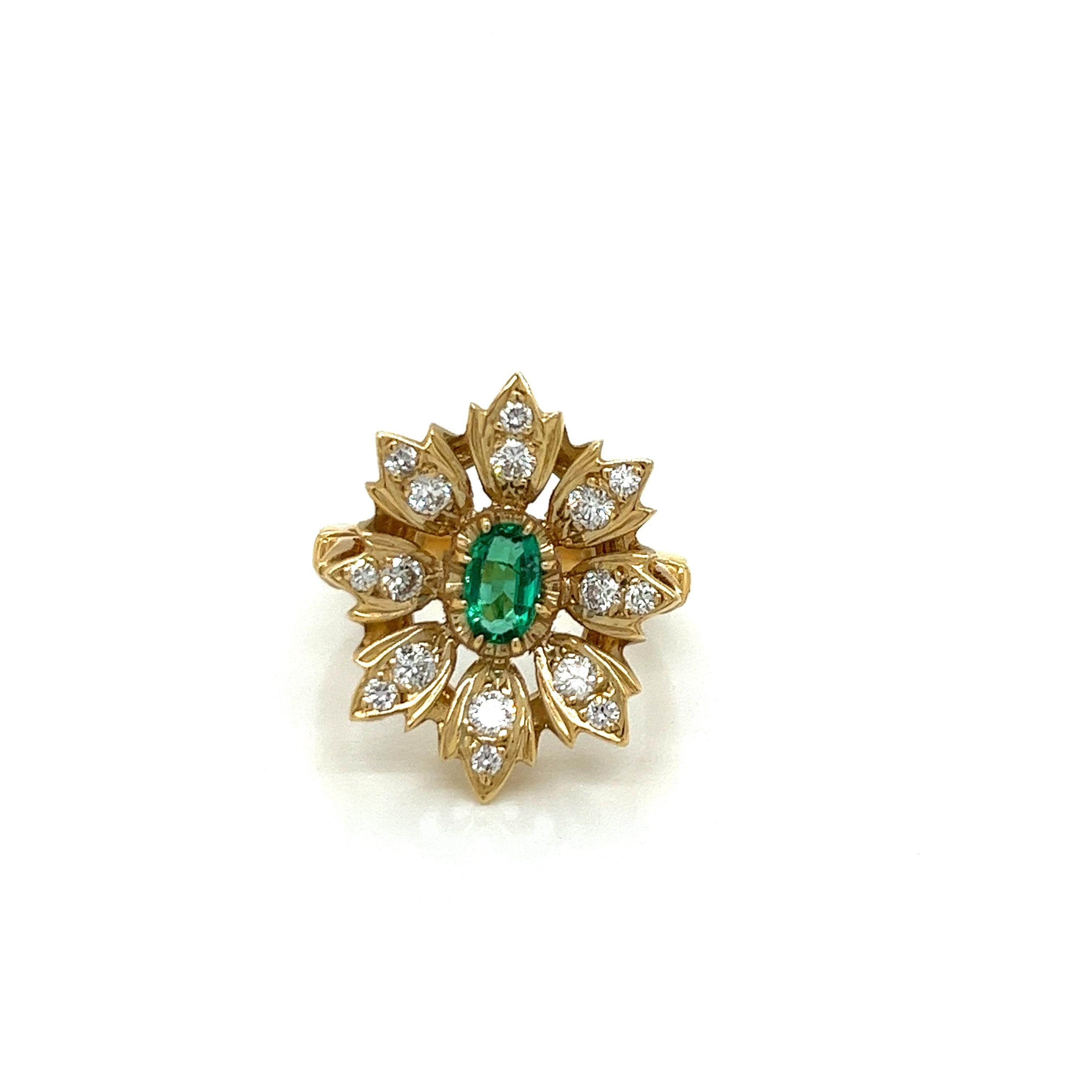 Vintage 14k yellow gold Victorian Reproduction Emerald and Diamond Ring - Manufactured in the 1980's, this Victorian reproduction ring is set with a 6x4mm vivid green emerald weighing approximately .50ct. The surrounding 8 leafs have 2 bright