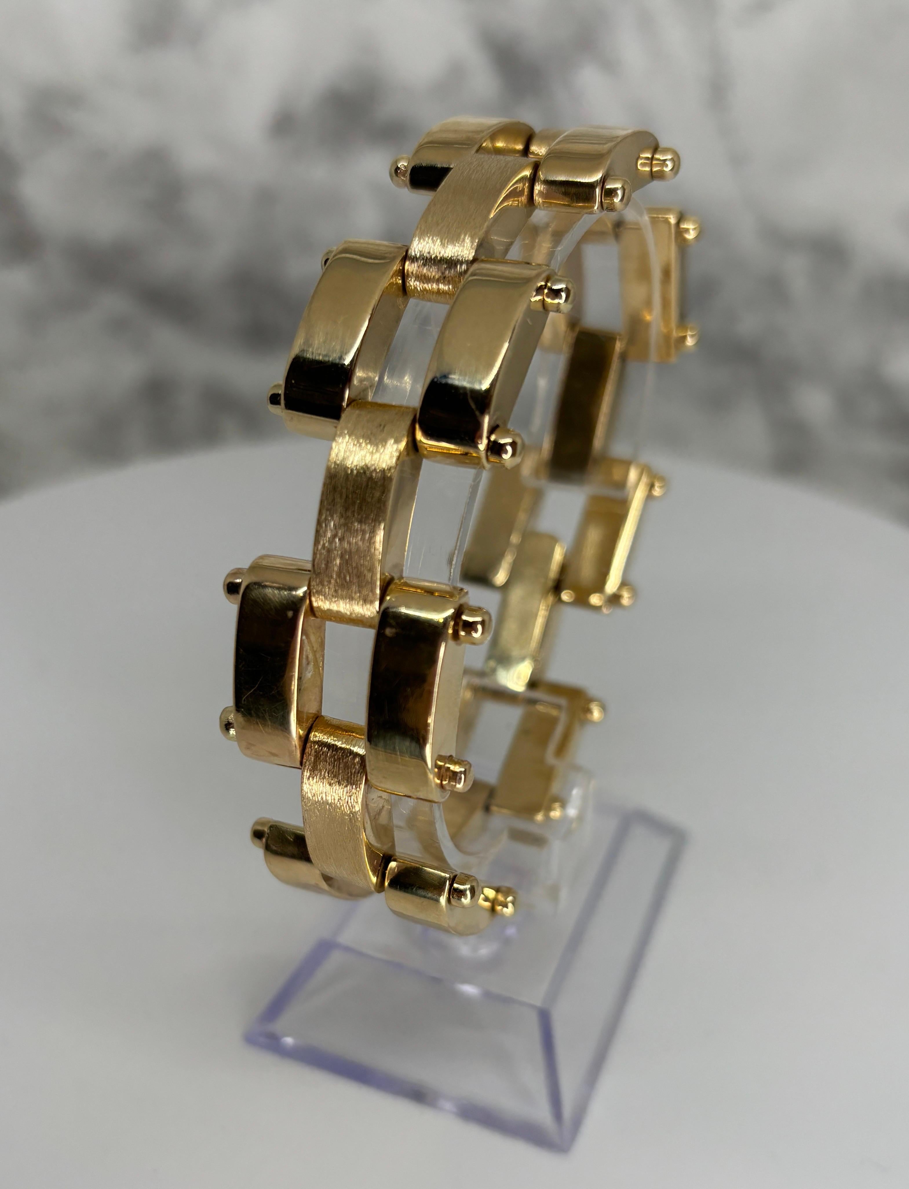 This unique 14k yellow gold wide link bracelet is a classic piece of jewelry that offers a bold, sophisticated look and can easily serve as a statement accessory in any collection.

This bracelet features a panther link design composed of large,