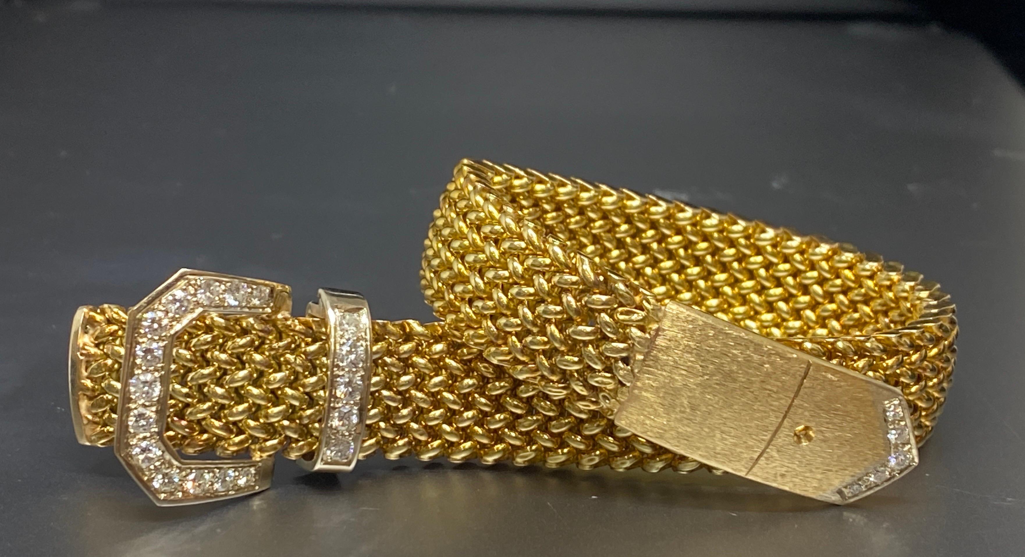 Up for your consideration is this stunning vintage 14 karat yellow gold diamond woven mesh buckle bracelet. This classic buckle bracelet features a yellow gold woven link bracelet band with a florentine finished end. The buckle clasp, keeper and tip