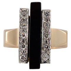 Bague cocktail vintage en or jaune et blanc 14 carats avec onyx allongé et diamants