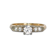 Bague solitaire vintage en or jaune/blanc 14 carats avec diamant 0,56 carat