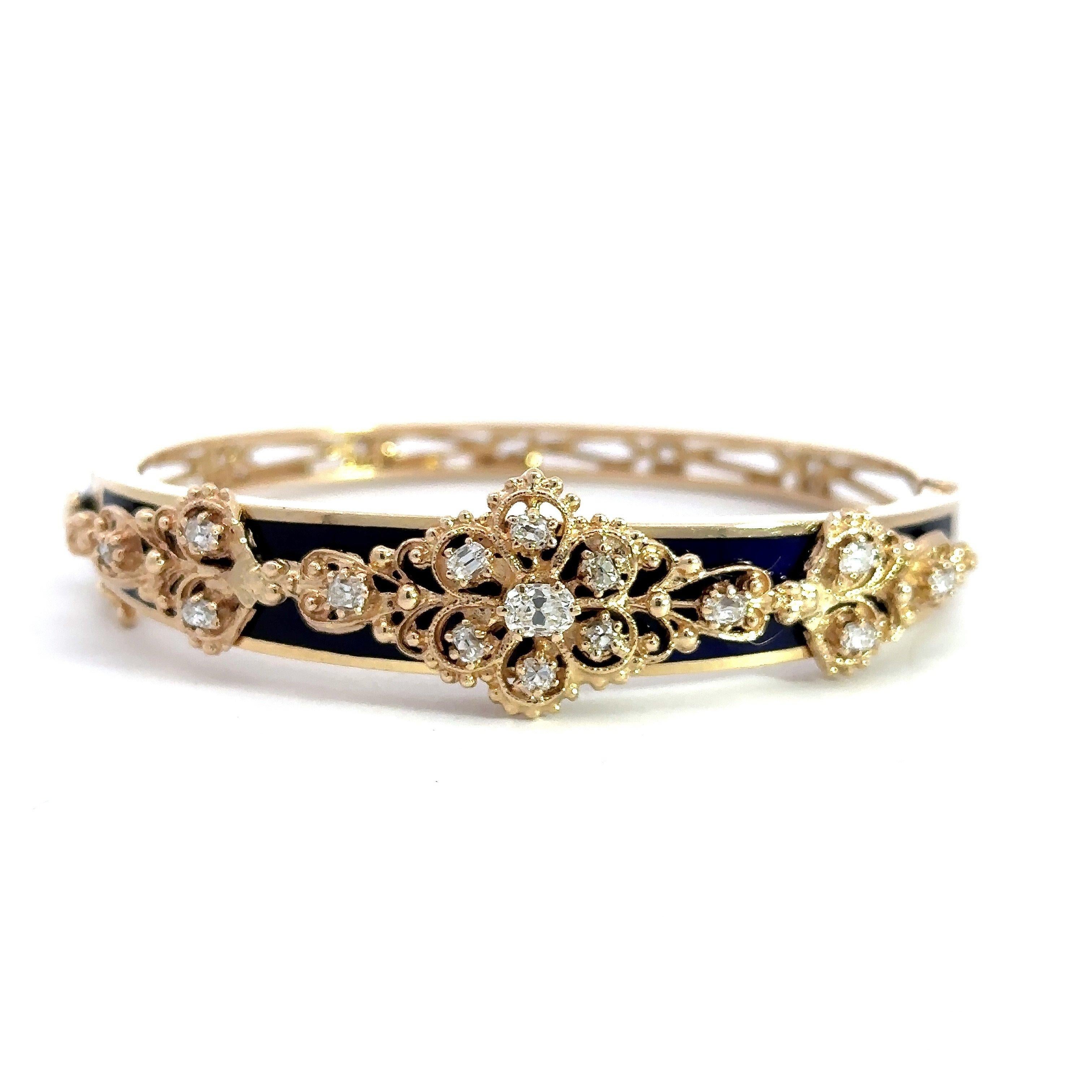 This Jack Gutschneider (stamped JG JLRY) bangle dates from the 1950's and is crafted in 14KT yellow gold with black enamel and approximately 1CT old mine cut diamonds, F Color, VS-SI Clarity. The bracelet measures 16.3mm at the widest point and