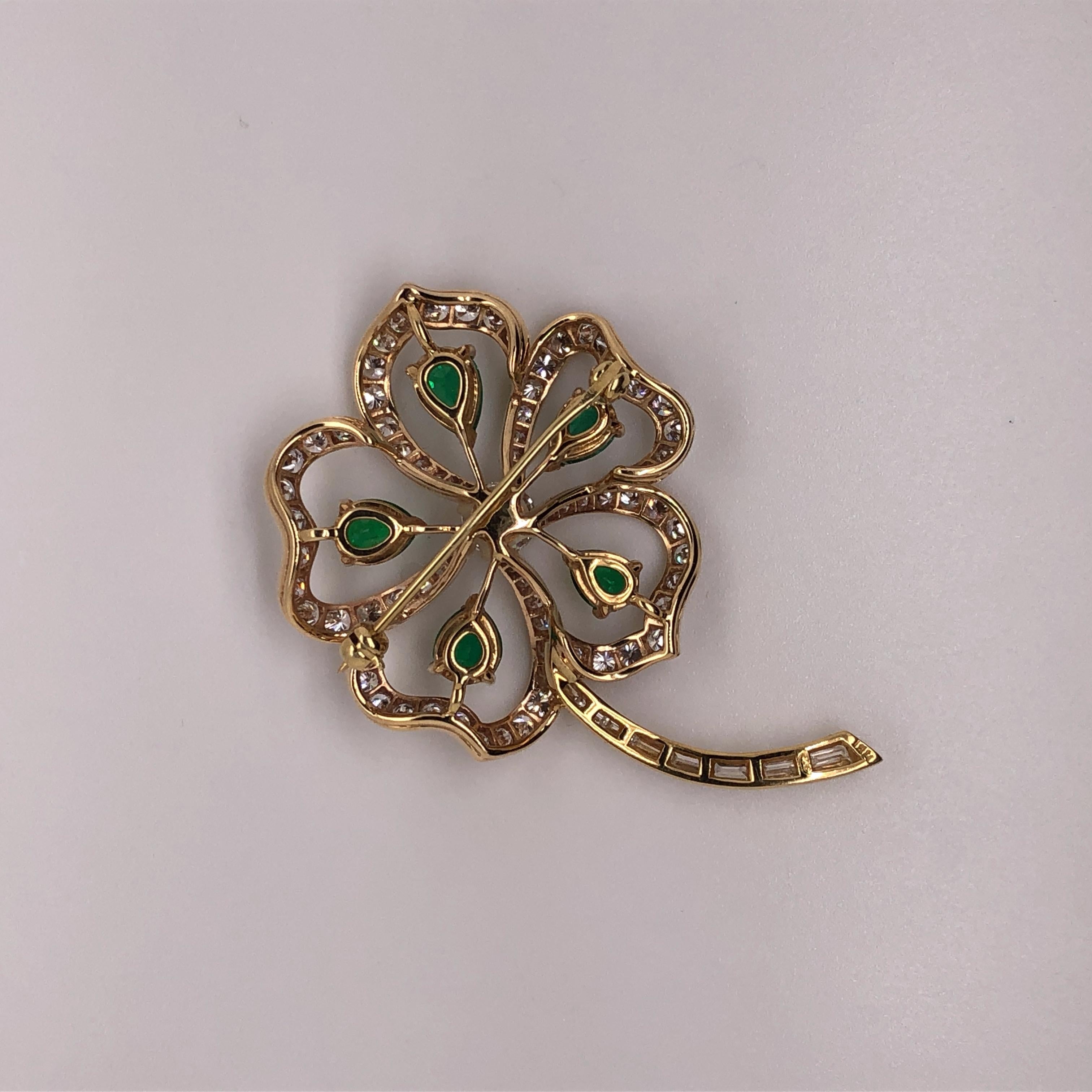 14kt yellow gold 4-Leaf Clover Pin. This pin contains 3.90 carats of H-I color, SI1-SI2 clarity diamonds and 2.36 carats of emeralds. The diamonds in this pin are graded higher than the standard color and clarity for most engagement rings in the