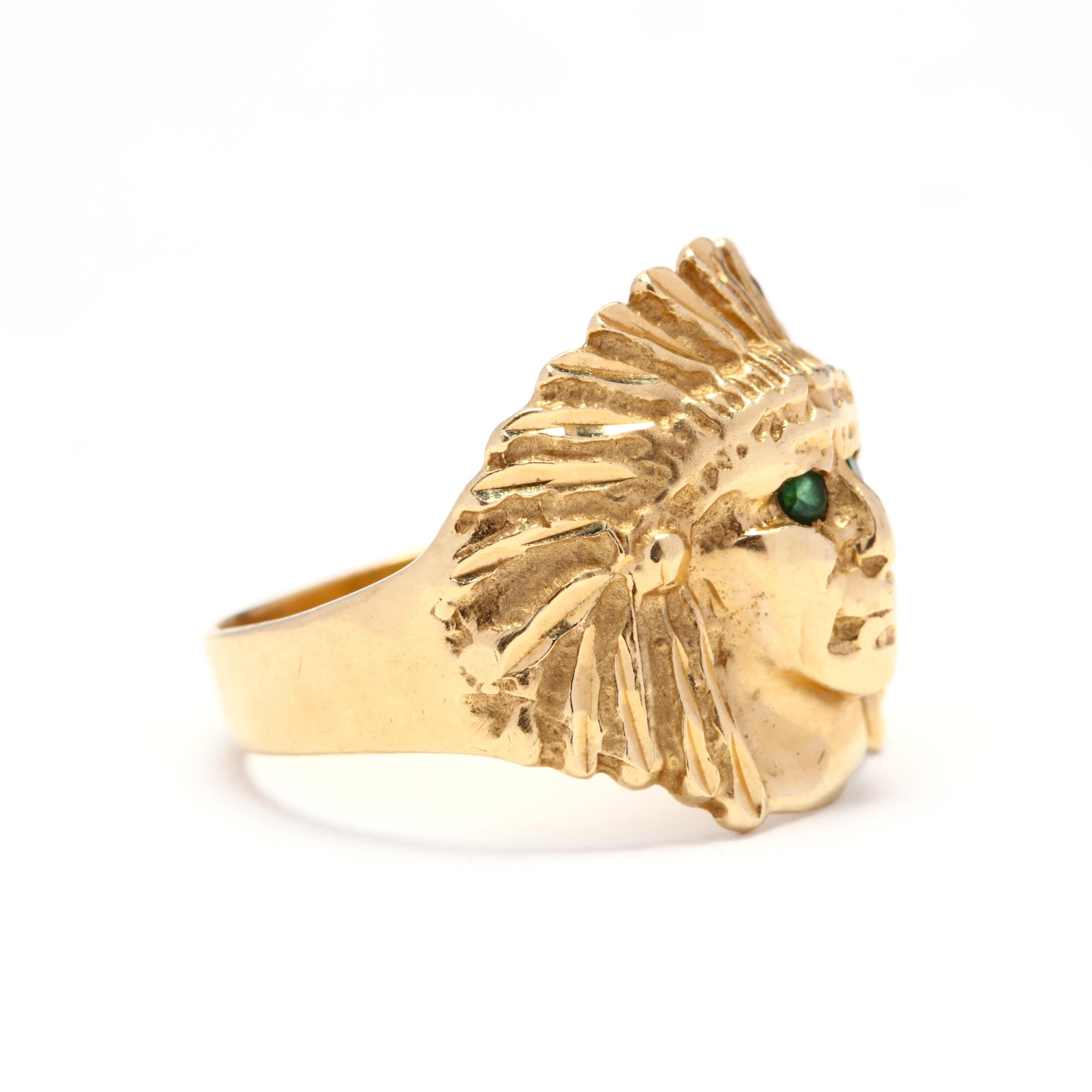 Vintage 14 karat gold and emerald Indian head ring. This ring features and Indian head motif with round cut emerald eyes and a slightly tapered shank.

Stones:
- emeralds, 2 stones
- 1.5 mm

Ring Size 4.75

Width 15.4 mm

2.73 dwts

* Please note