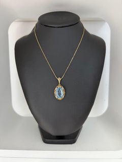 Vintage 14kt Gold Pendant with 10.00ct Oval Blue Topaz