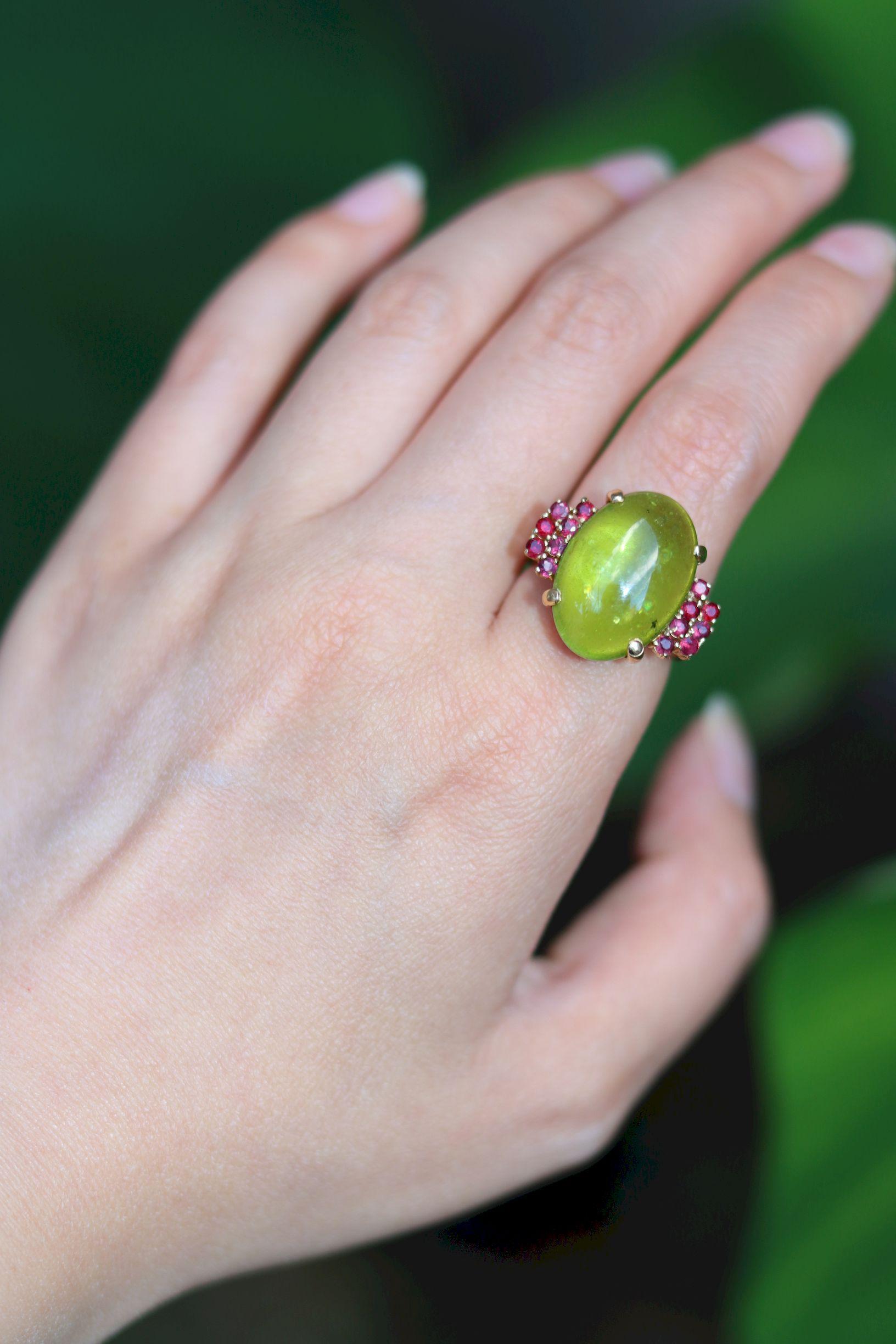Vintage 14KT Gold Peridot Garnet Ring

Marked:
585

Approximate Dimensions:
5.75 (Ring Size) 
1.8 cm (Width)
19.36 mm x 13.63 mm x 6.28 mm (Peridot)
Approx. 0.42 ct (Garnet)
9.8 grams in weight.

* All dimensions listed above are approximations