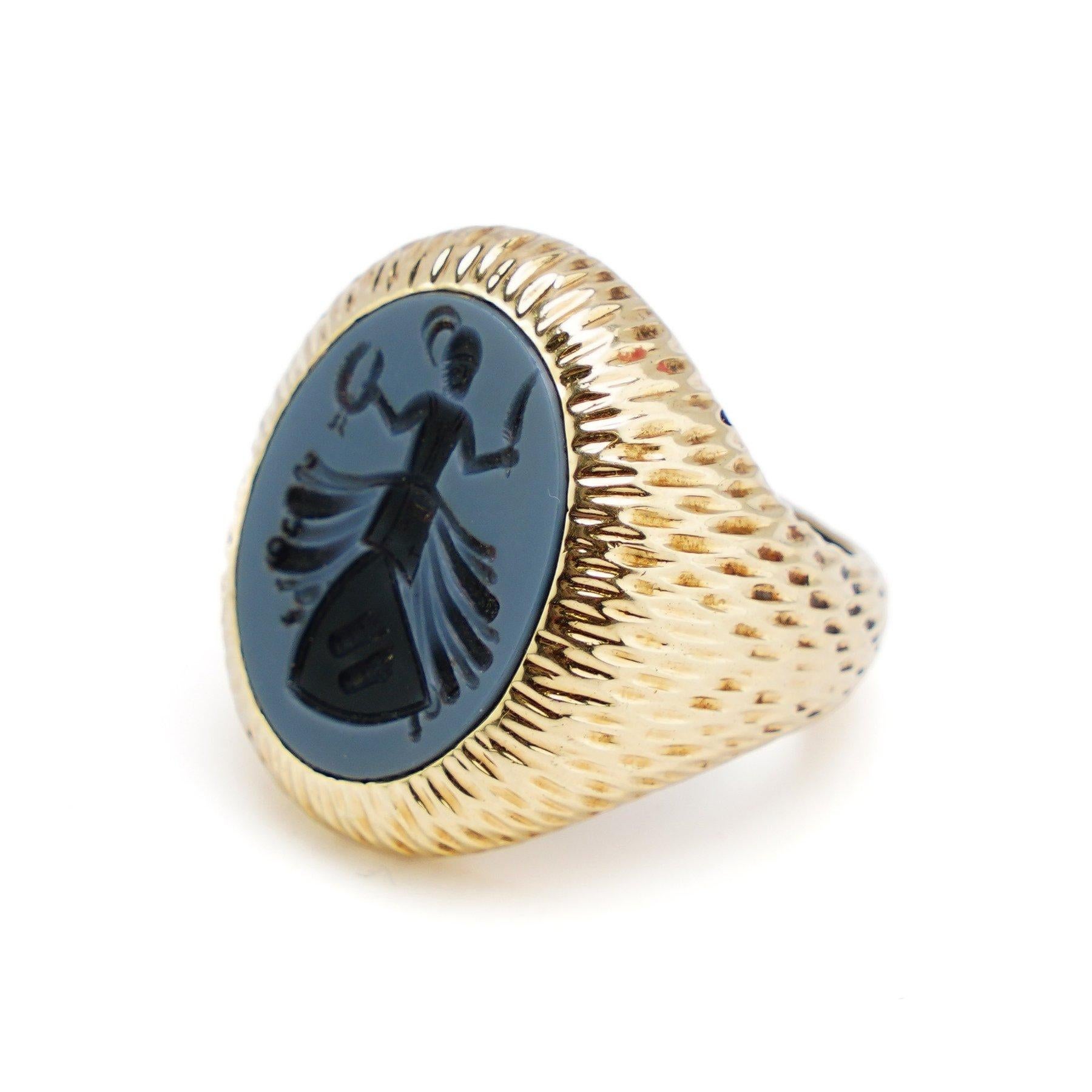 Vintage signet ring crafted from 14kt yellow gold, featuring an oval carved sardonyx intaglio.
The intaglio depicts a Sufi male engaged in the traditional whirling dance, holding a wreath and feather.
This exquisite piece, dating back to the 1970s,
