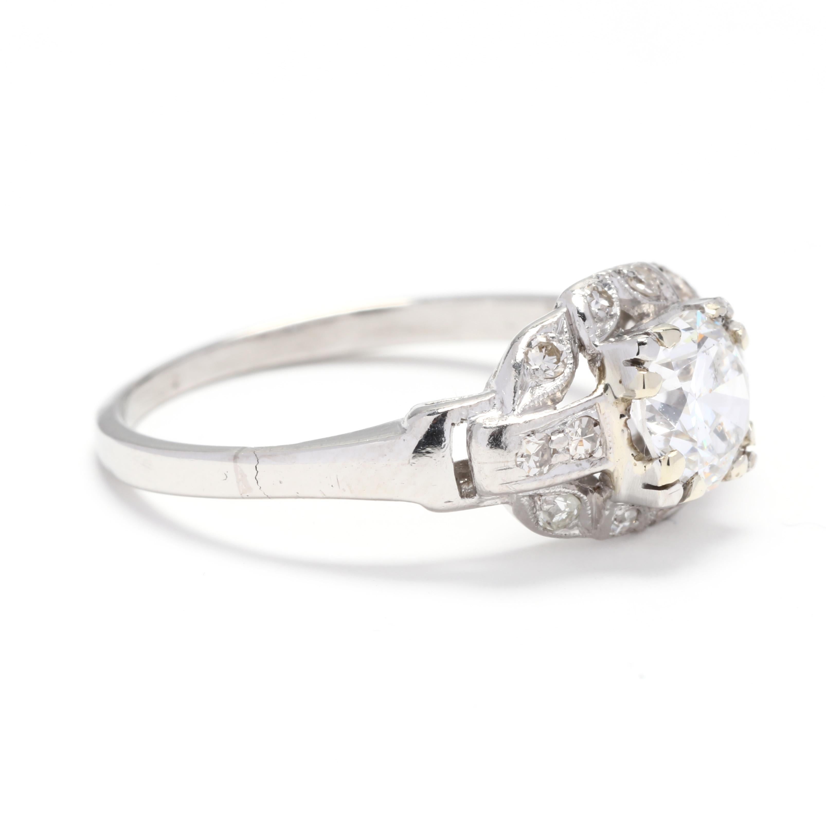 A vintage 14 karat white gold and diamond engagement ring. This ring features a round brilliant cut weighing approximately .85 carat with single cut diamond accents surrounding the center stone and a slightly tapered polished band.

Stones:
-