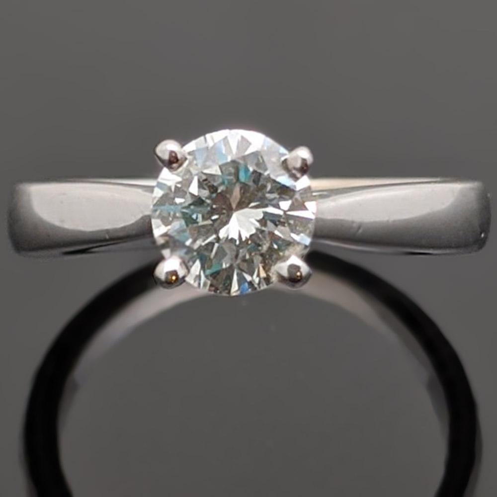 This 14kt white gold ring features a round brilliant cut diamond with an estimated weight of 0.54ct. in a cathedral setting with tapered soft tapered shoulders. Estimated weight of gold is 2 gr. 

We will size it for you.

