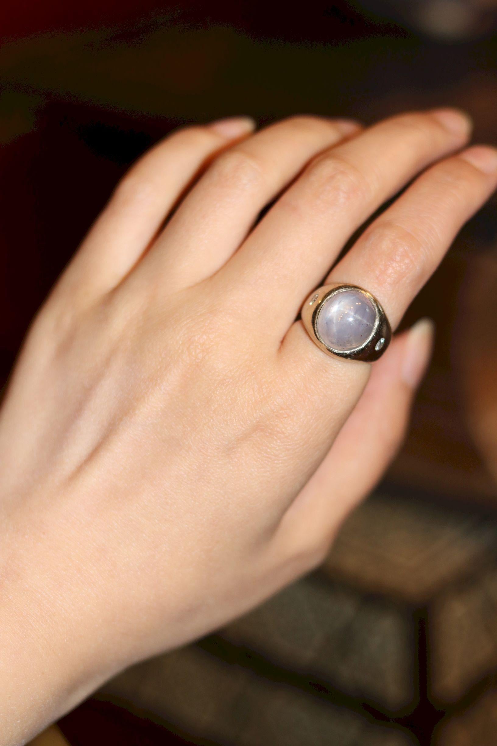 Vintage 14KT White Gold Star Sapphire Diamond Ring

Marked:
14K

Approximate Dimensions:
5.5 (Ring Size) 
1.5 cm (Width)
12.89 mm x 11.43 mm x 11.35 mm (Star Sapphire)
Approx. 0.16 ct (Diamond)
14.1 grams in weight.

* All dimensions listed above