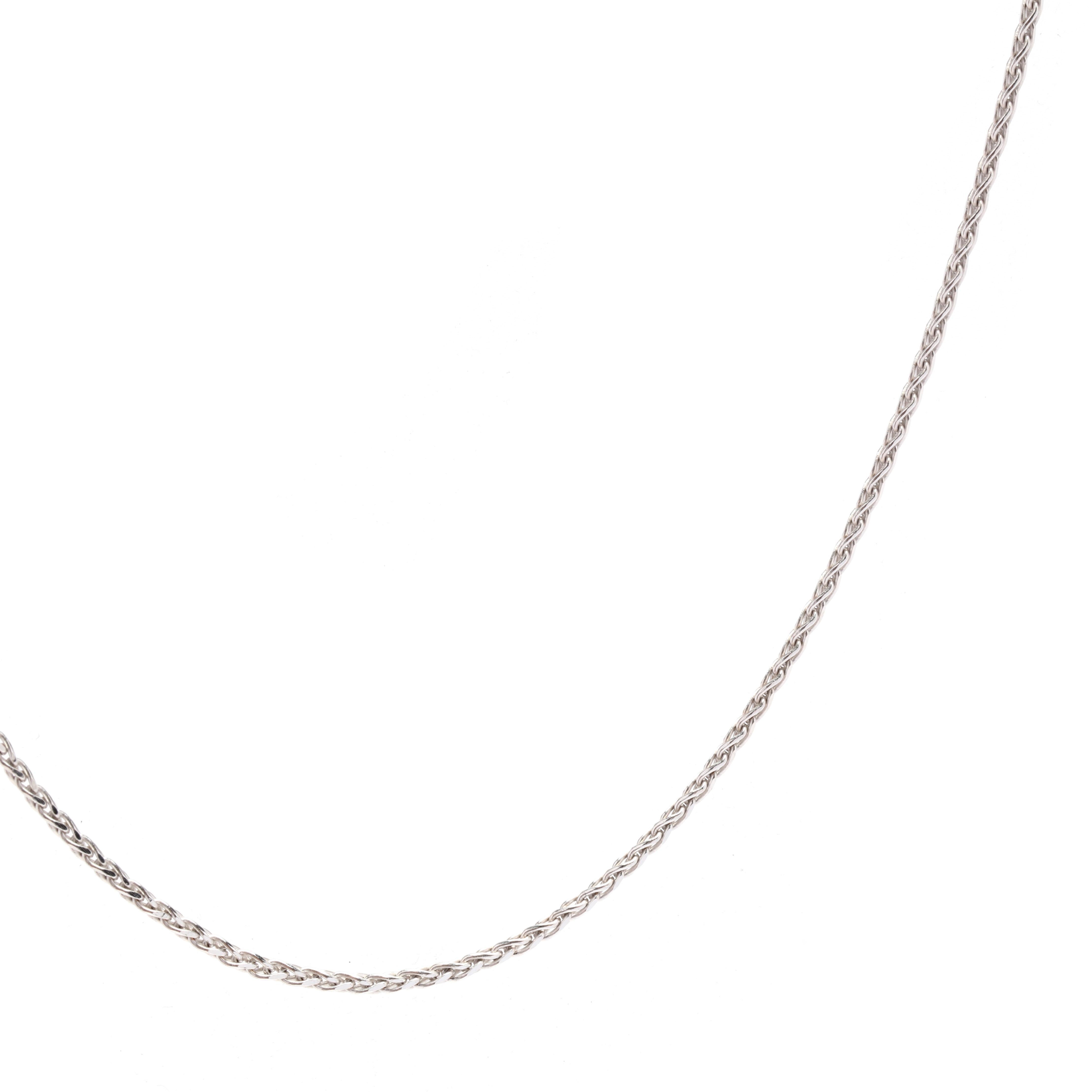 A vintage 14 karat white gold wheat chain. This thin pendant chain features a thin woven wheat design with a lobster clasp.

Length: 16 in.

Width: 1 mm

Weight: 1.5 dwts. / 2.33 grams

Stamps: 14K

Ring Sizings & Modifications:
*Please reach out