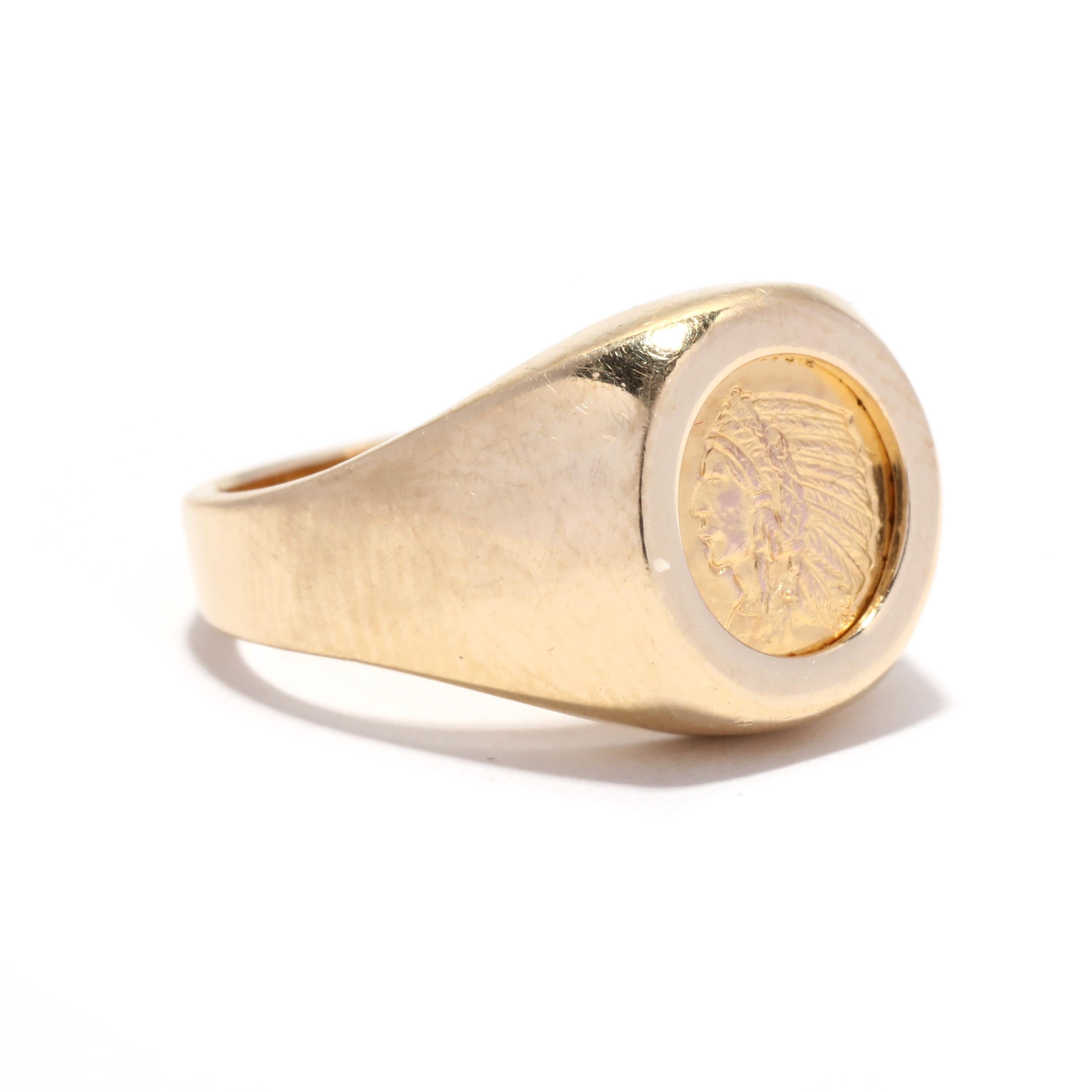 A vintage 14 karat yellow gold American Indian coin signet ring. This ring features a mini American Indian coin that is bezel set in a plain signet ring mounting and with a tapered band.

Ring Size 6

Length: 7/16 in.

Weight: 2.7 dwts. / 4.2