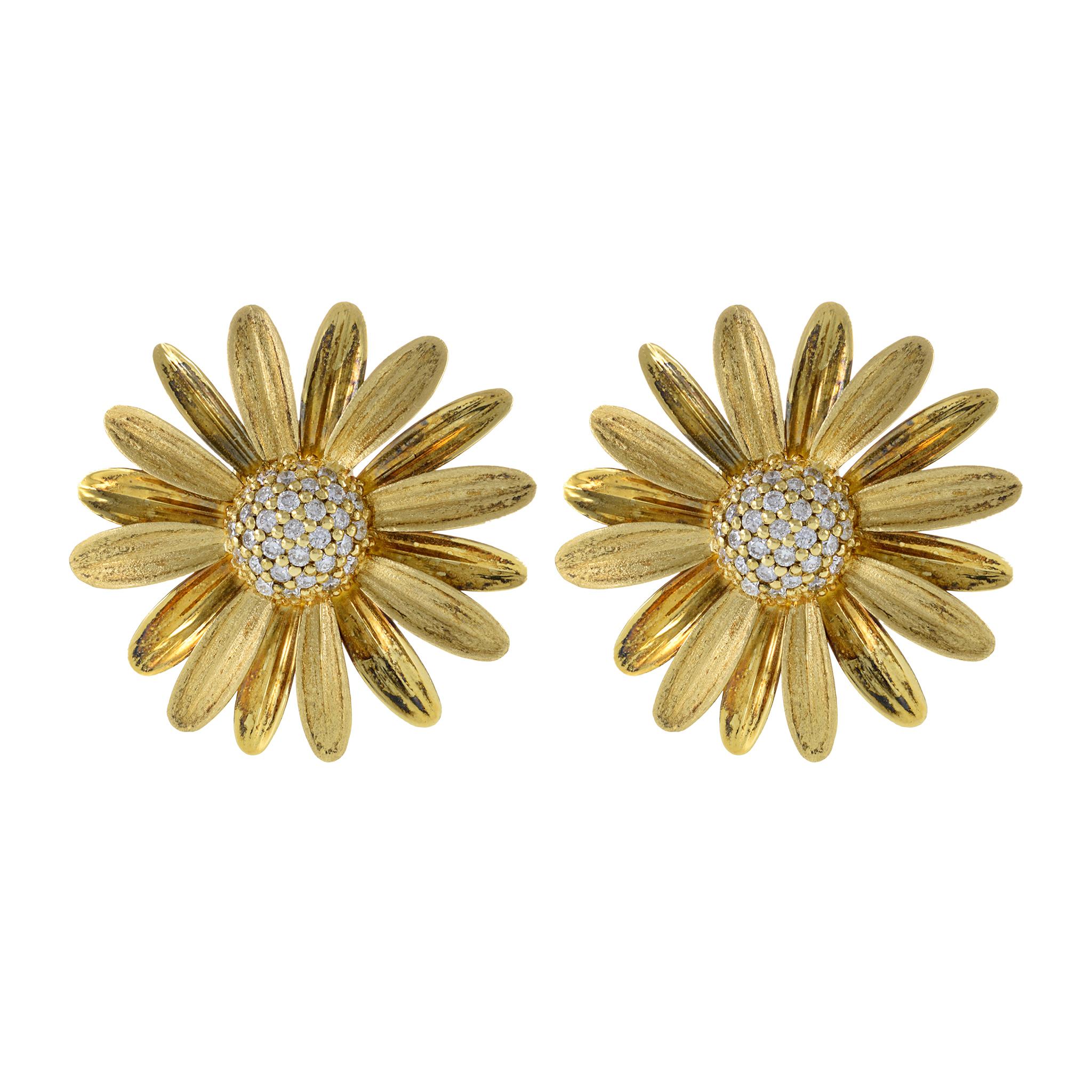 Luxurious, one-of-a-kind earrings that transport you to a time of sophistication and grace. These beautiful, statement pieces feature a stunning vintage daisy design crafted from 14KT yellow gold and adorned with high-quality diamonds, totaling 1.37