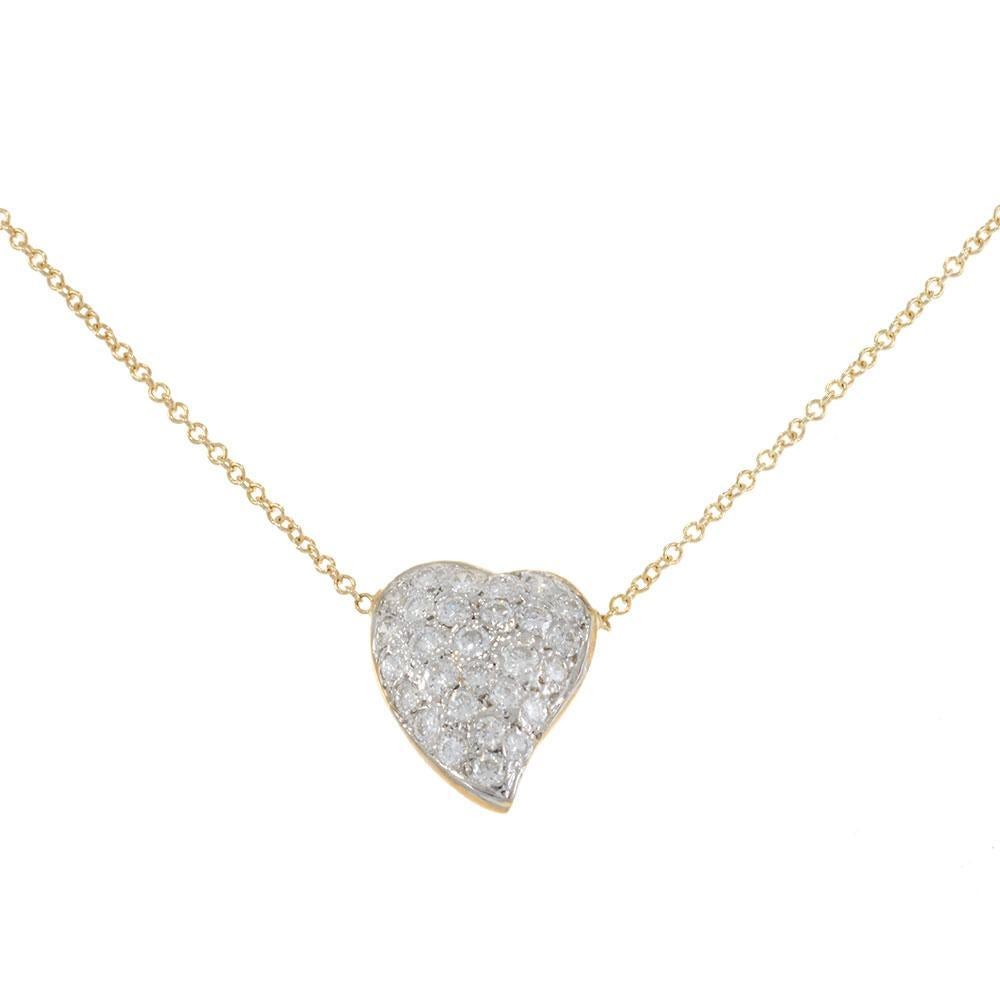 A timeless token of love, this vintage necklace features a charming heart pendant fully encrusted with approximately 0.60CT total weight in round brilliant-cut diamonds. Crafted in 14KT yellow gold, the delicate design is classic yet radiant, making