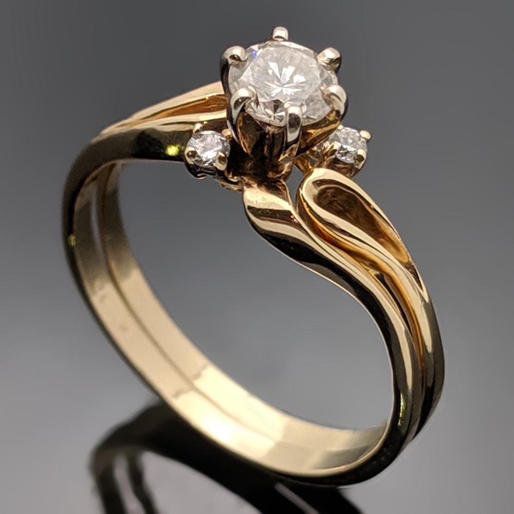 These rings are vintage 14kt yellow gold and diamond rings that when worn together create a unique piece. The estimated weight of diamonds are 0.54ct. with the ring and band together. The larger center diamond is a round brilliant cut diamond with