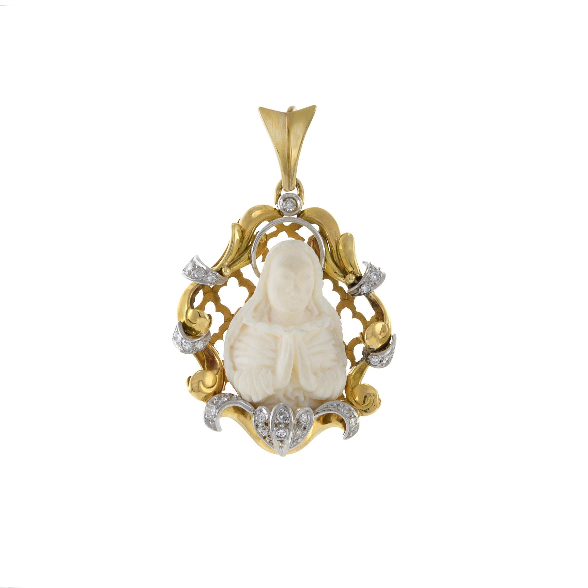 Vintage 14KT Yellow Gold Diamond Virgin Mary Carving Pendant, a symbol of faith and timeless elegance. Crafted with exquisite detail, this pendant features a delicate carving of the Virgin Mary, radiating serenity and grace. Set in lustrous 14KT
